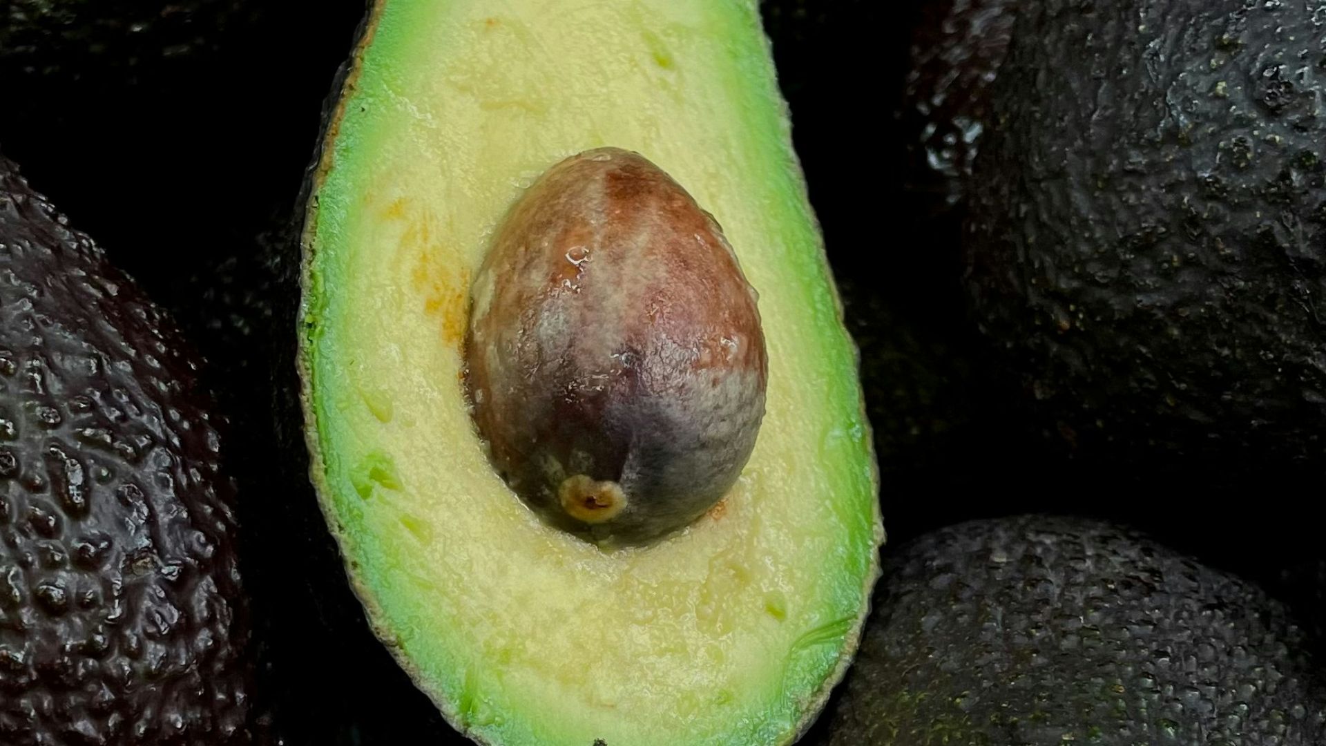 green and brown fruit on black and brown fruits