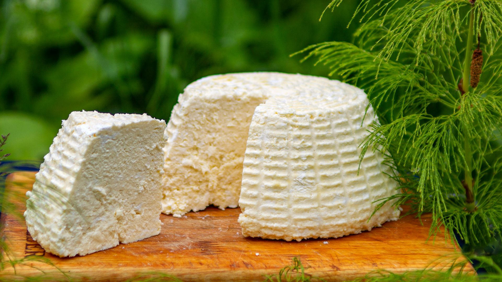 a piece of cake sitting on top of a wooden cutting board