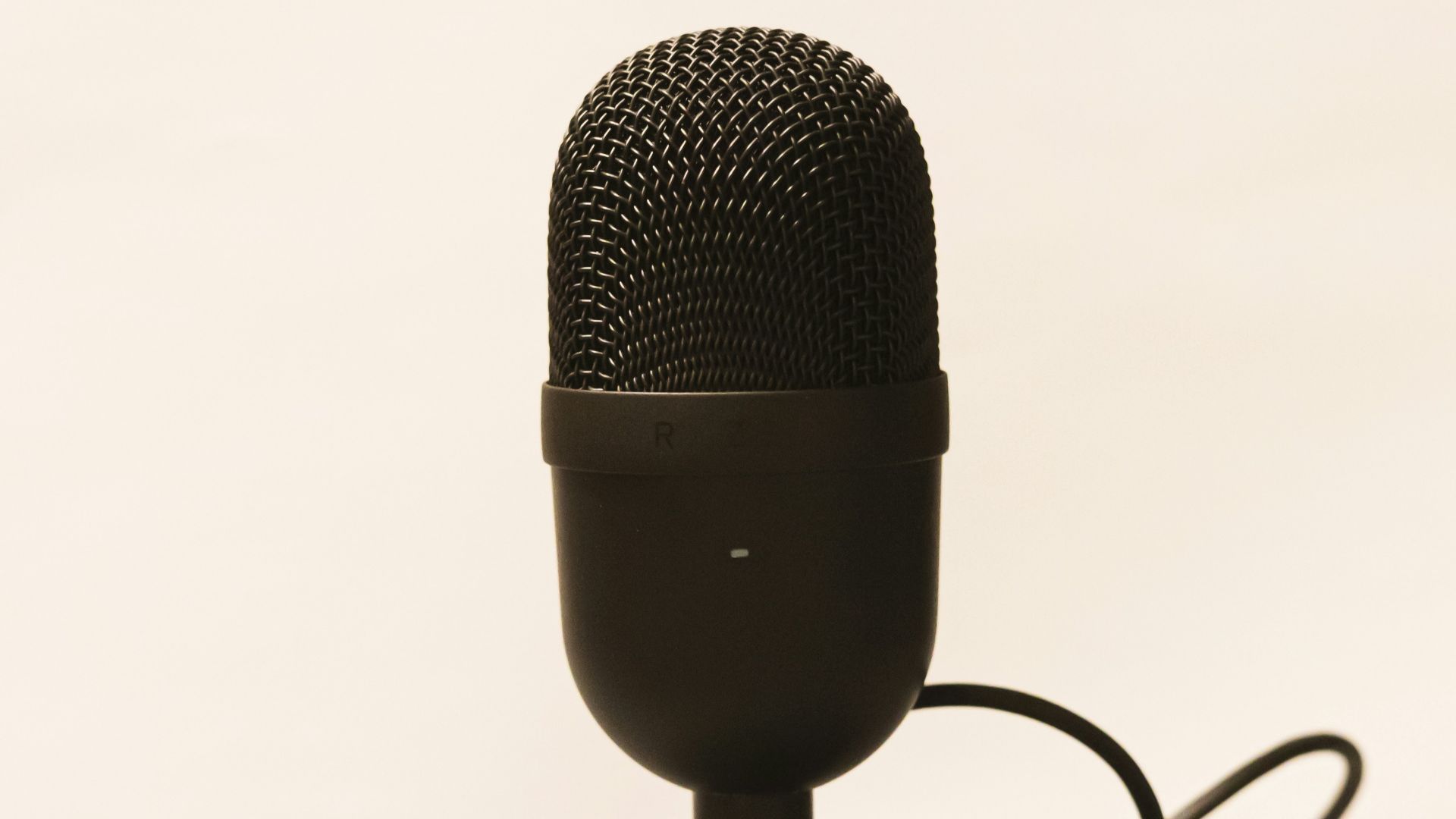 a microphone is plugged into a charger