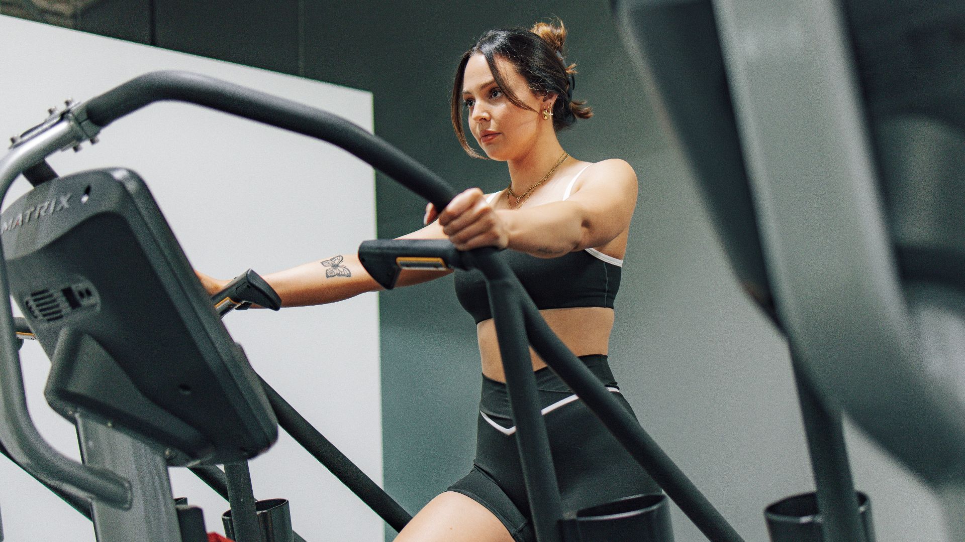 a woman on a treadmill in a gym
