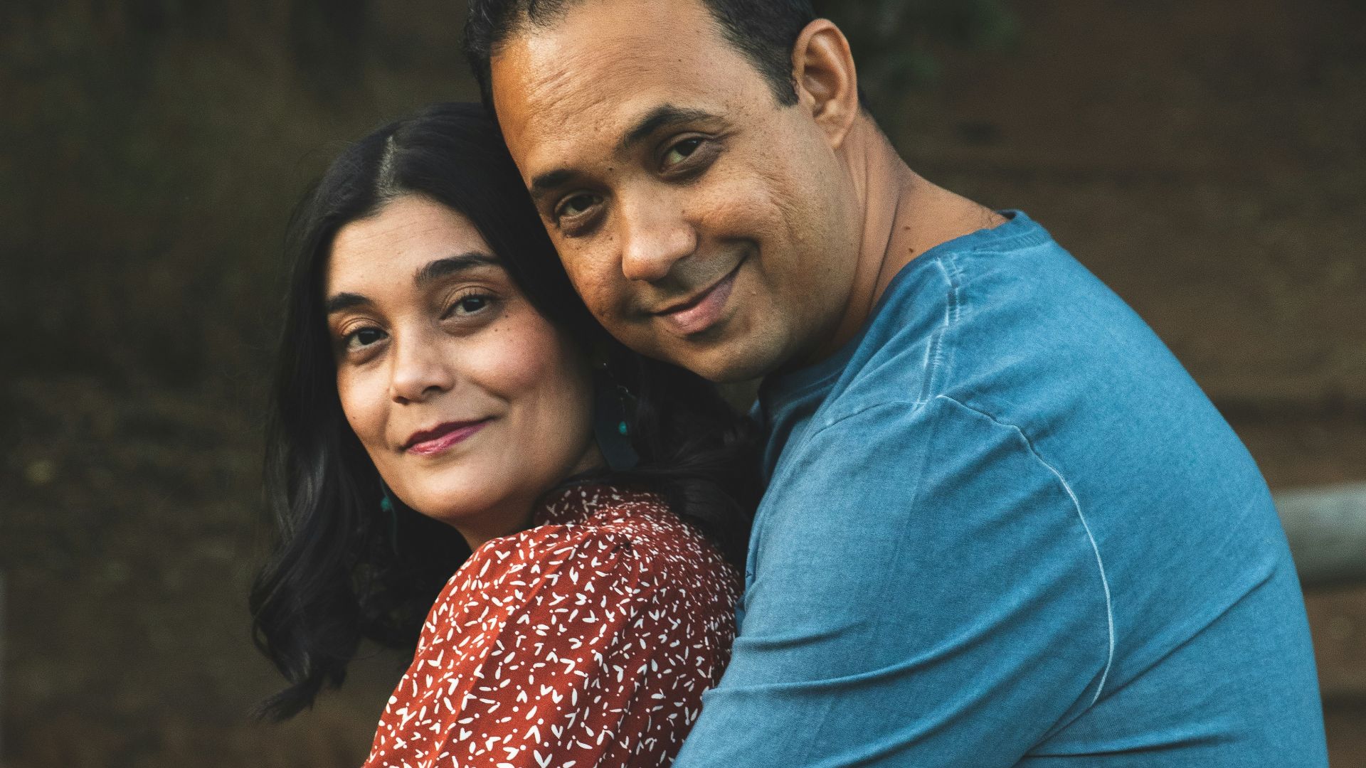 a man and a woman hugging each other