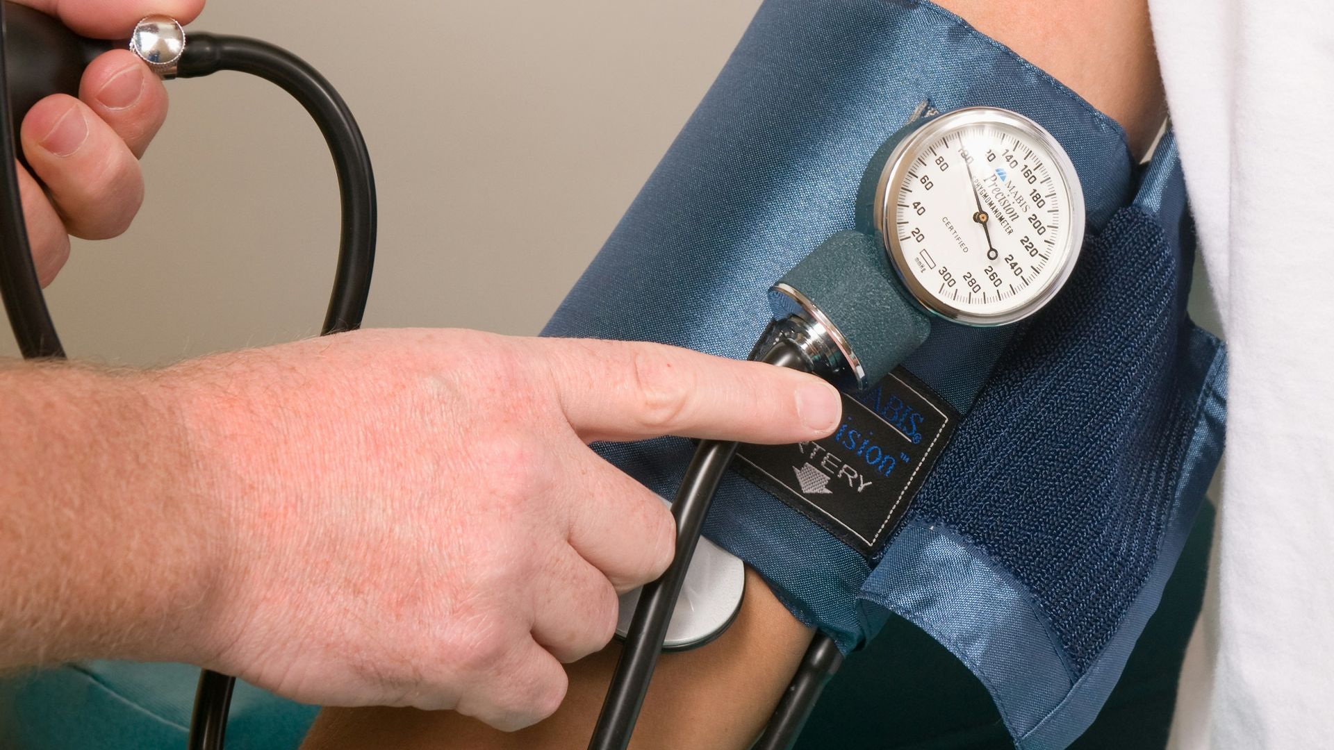 a doctor checking the blood pressure of a patient