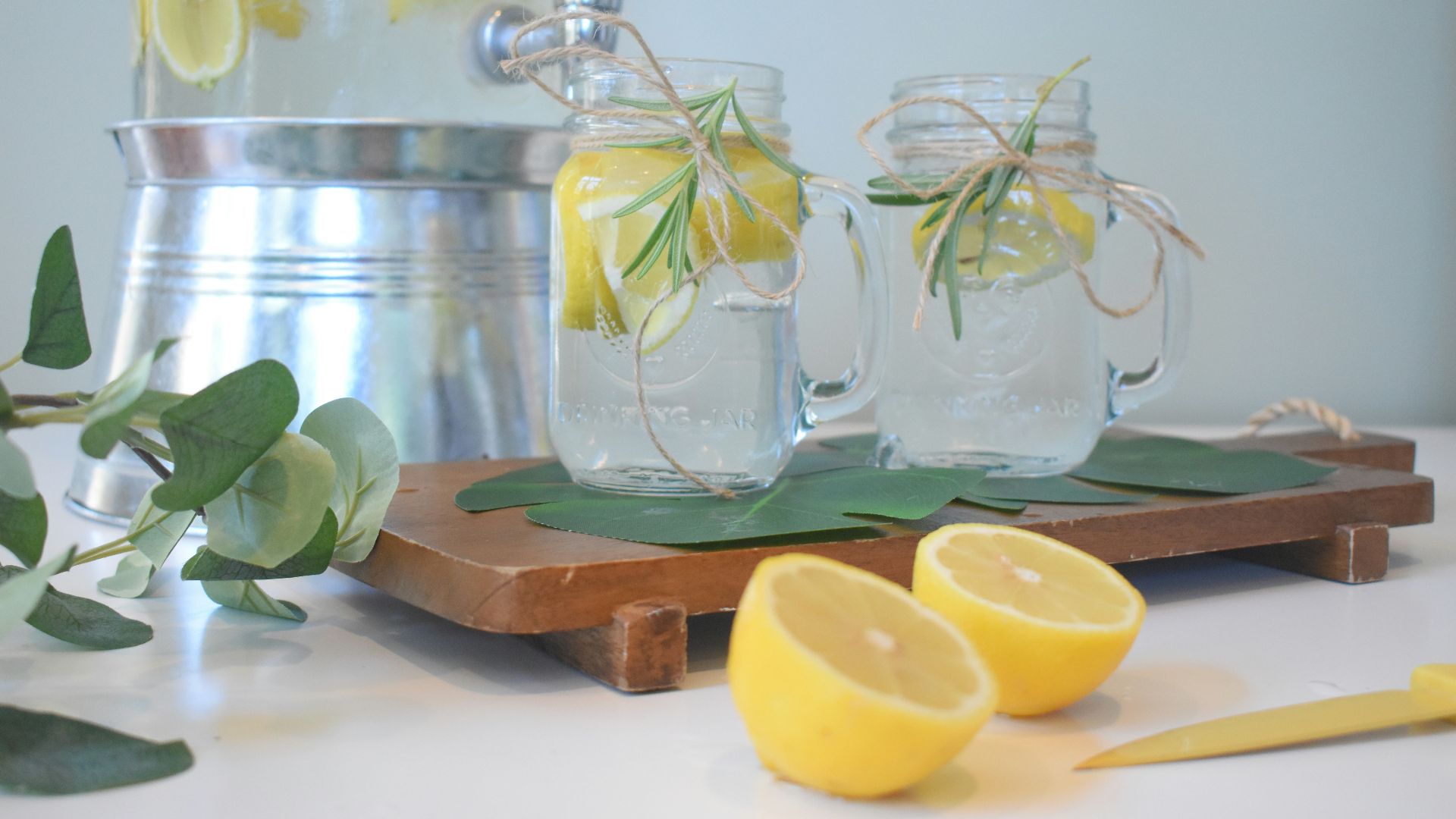 a couple of lemons sitting on top of a cutting board