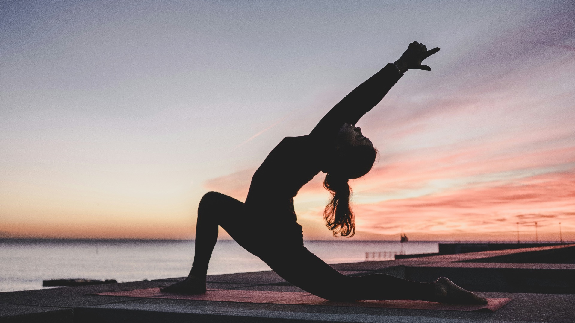 silhouette photography of woman doing yoga