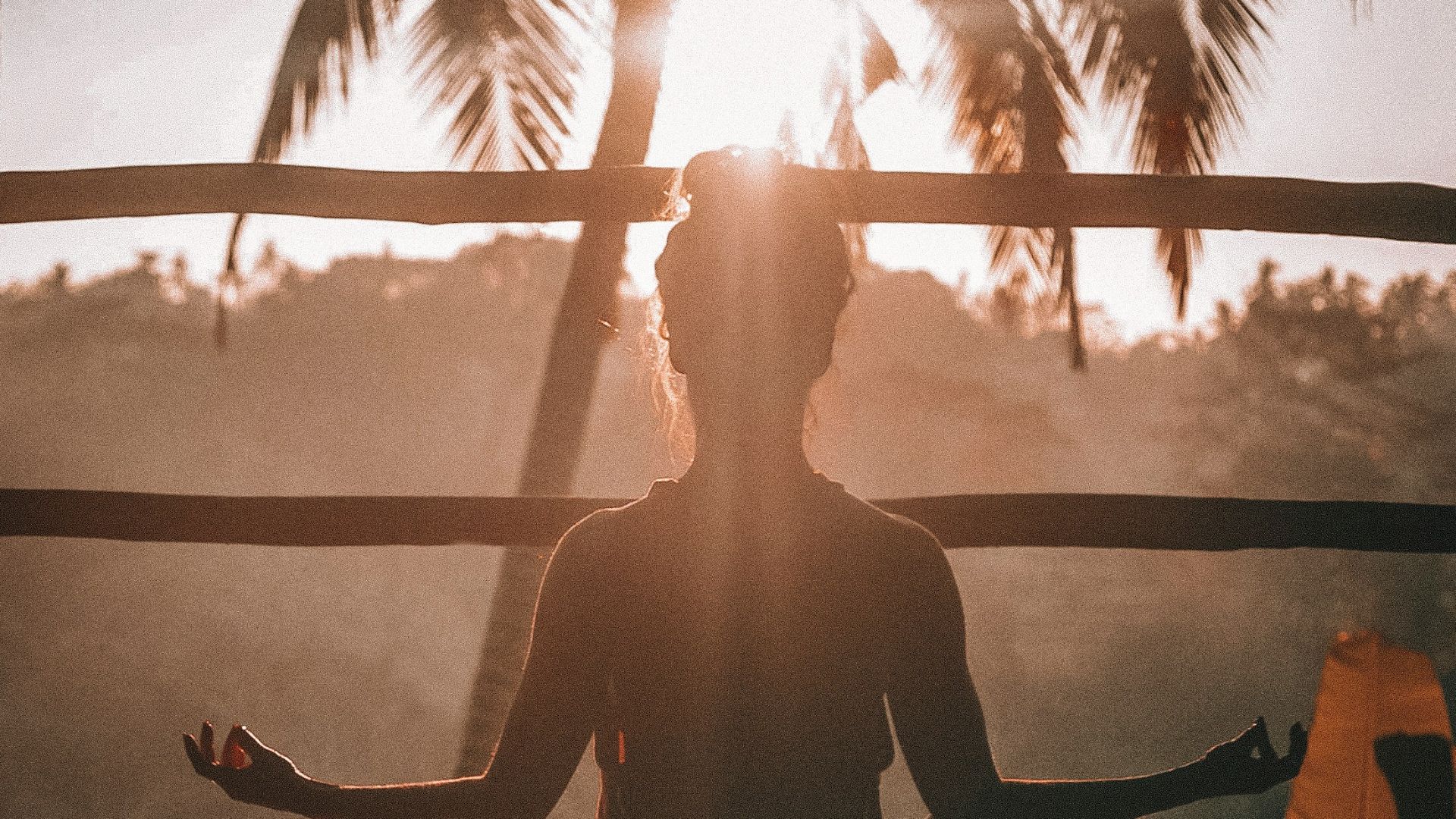 woman doing yoga meditation on brown parquet flooring