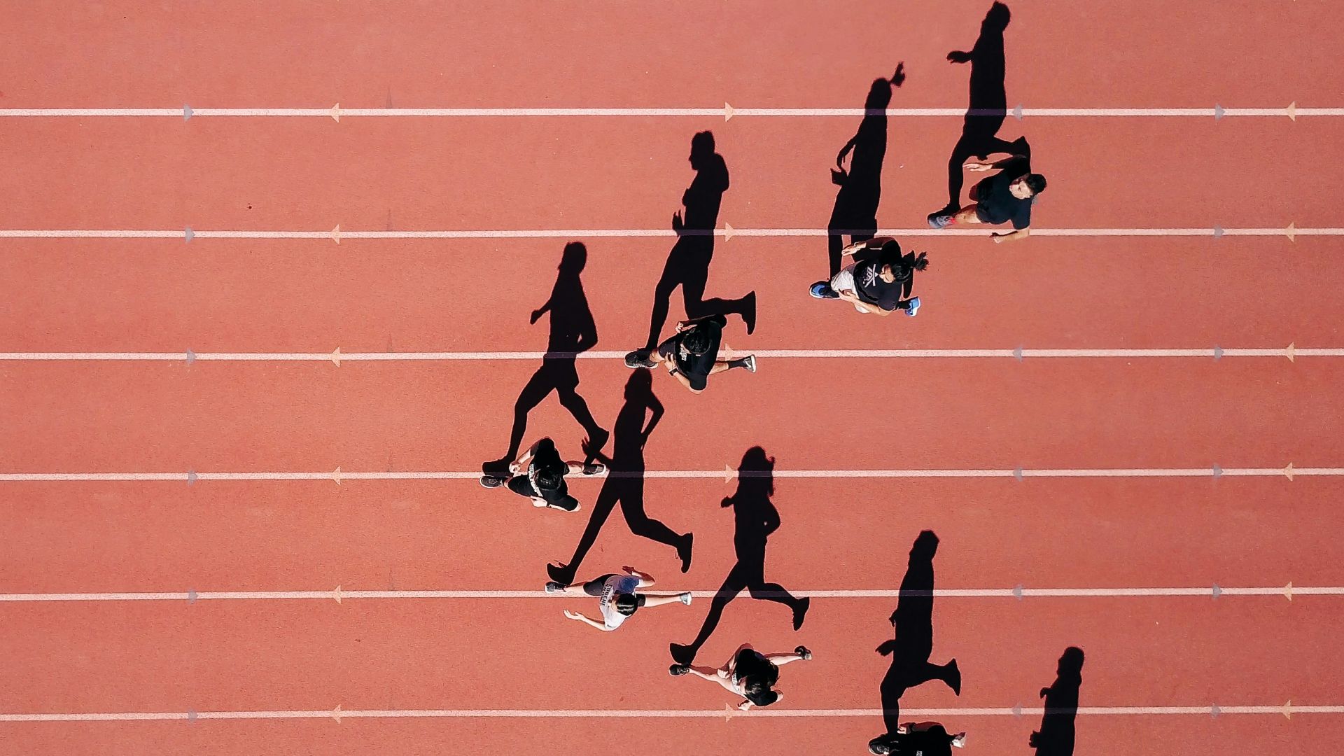 group of people running on stadium