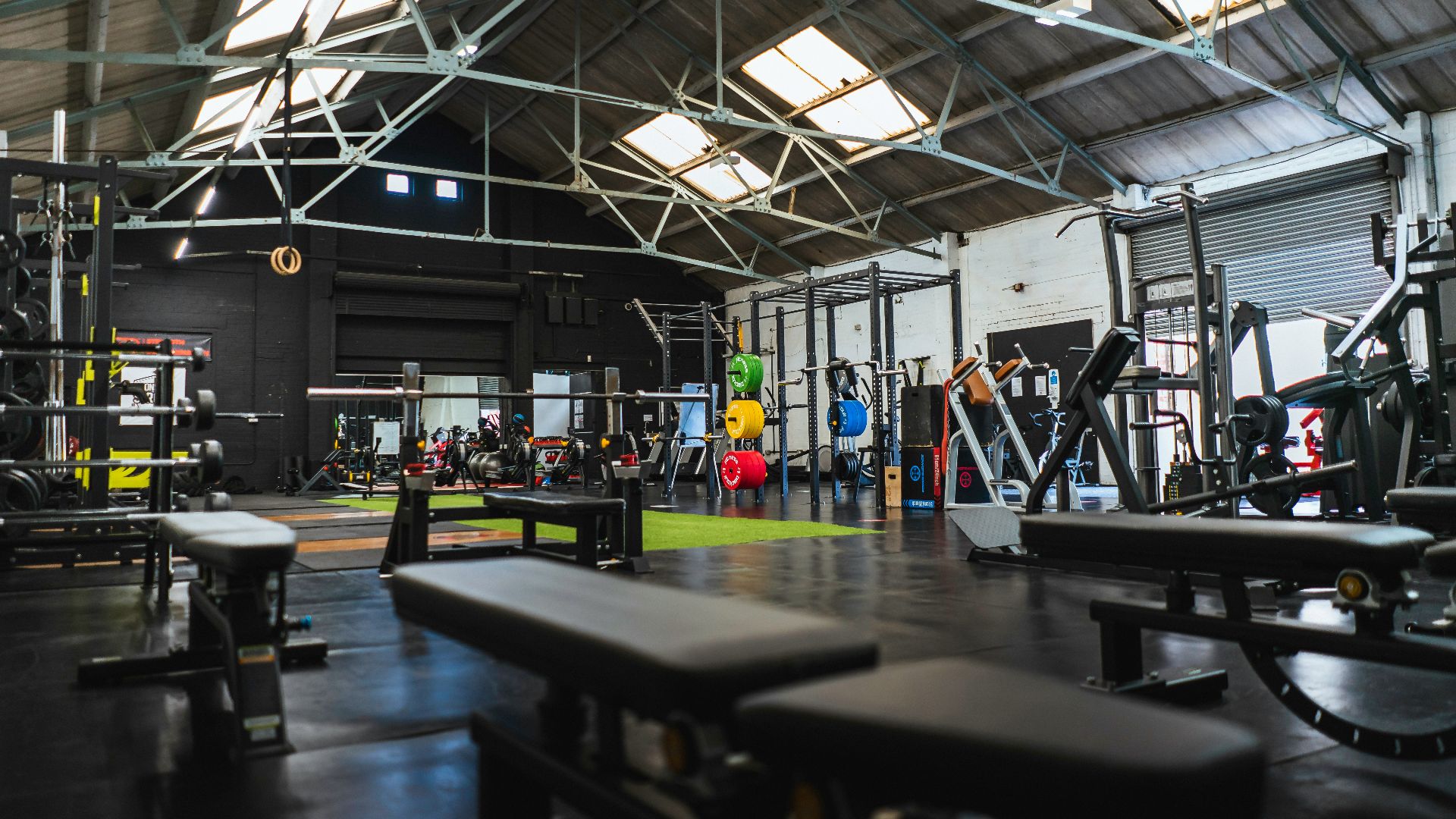 people in a room with a black table and chairs