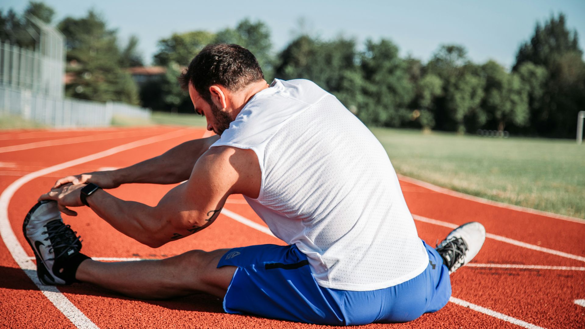man in white sleeveless top