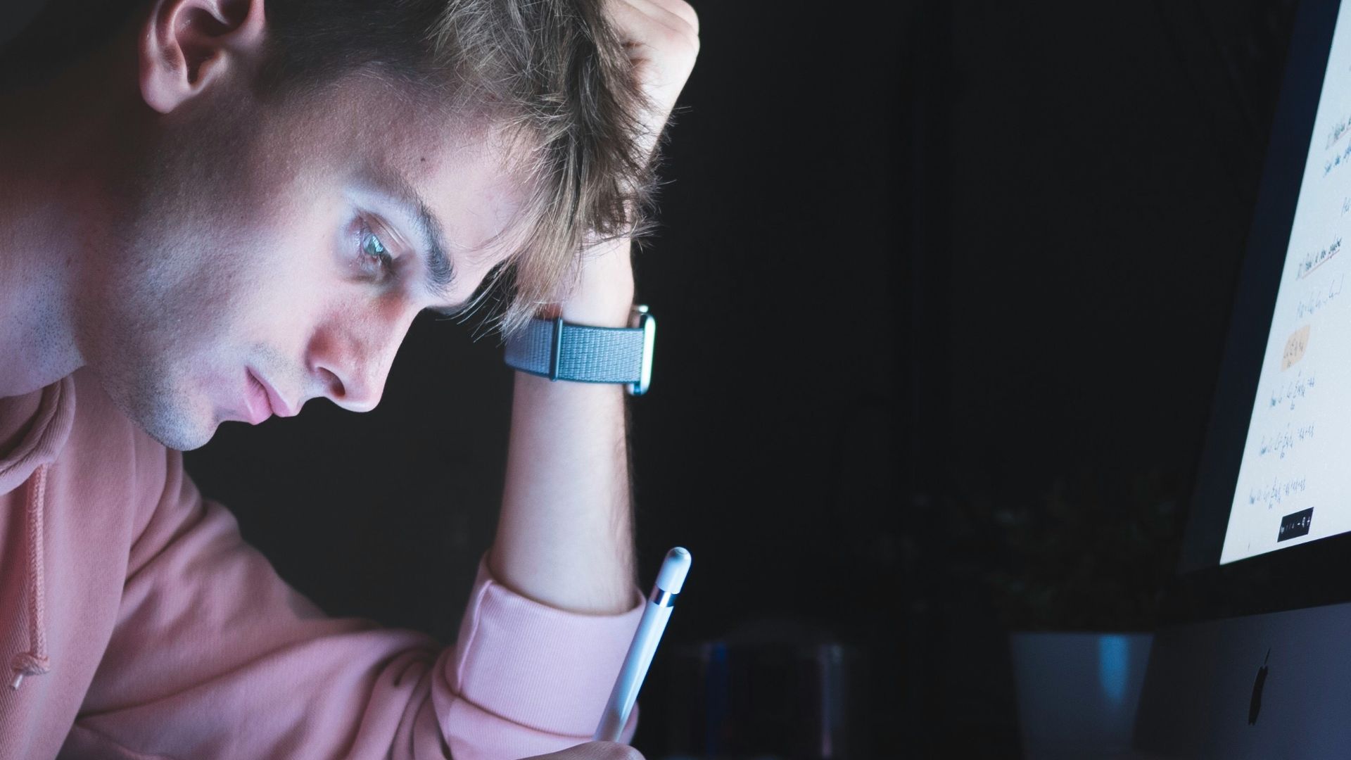man holding white stylus pen