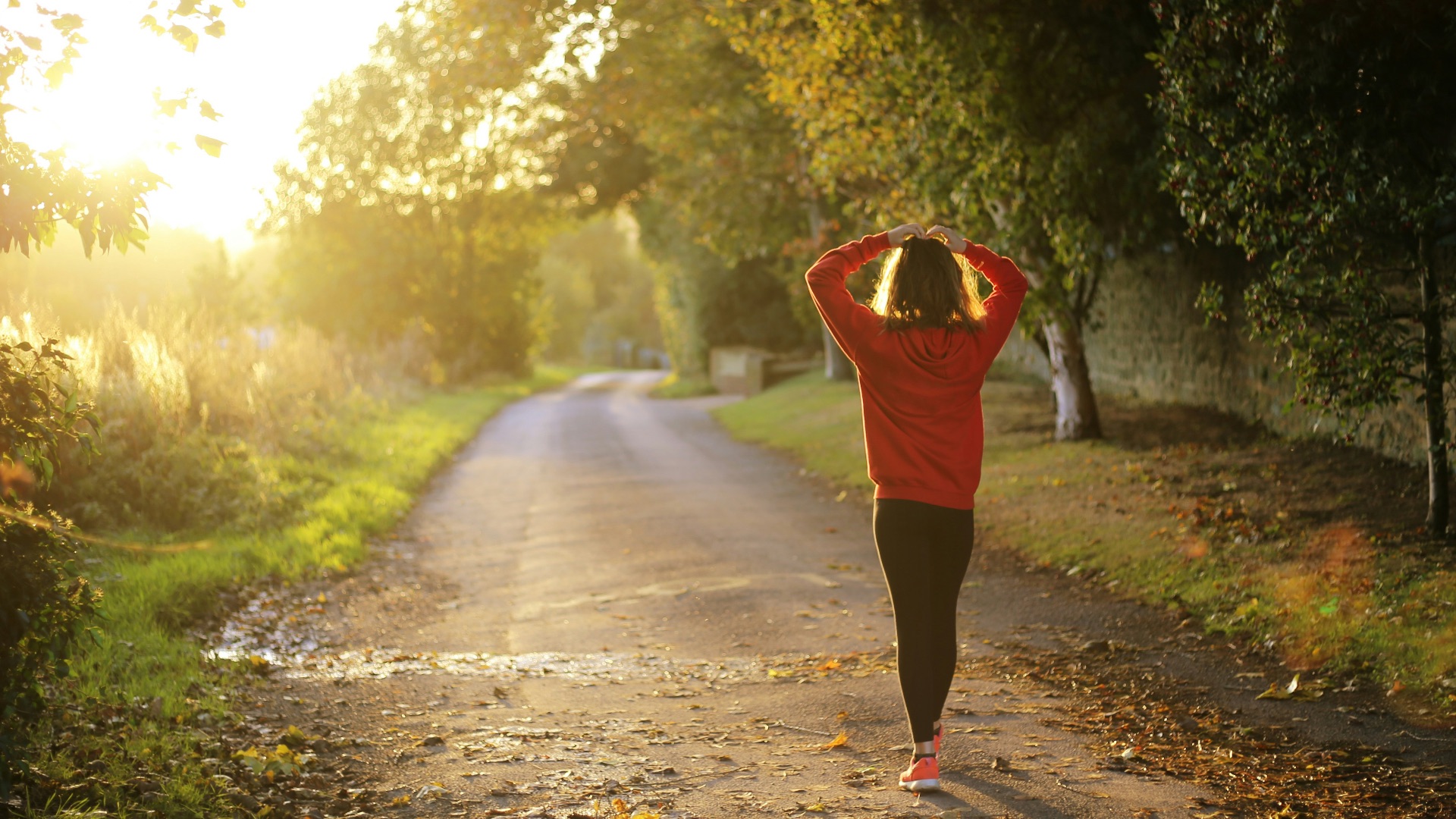 woman walking on pathway during daytime