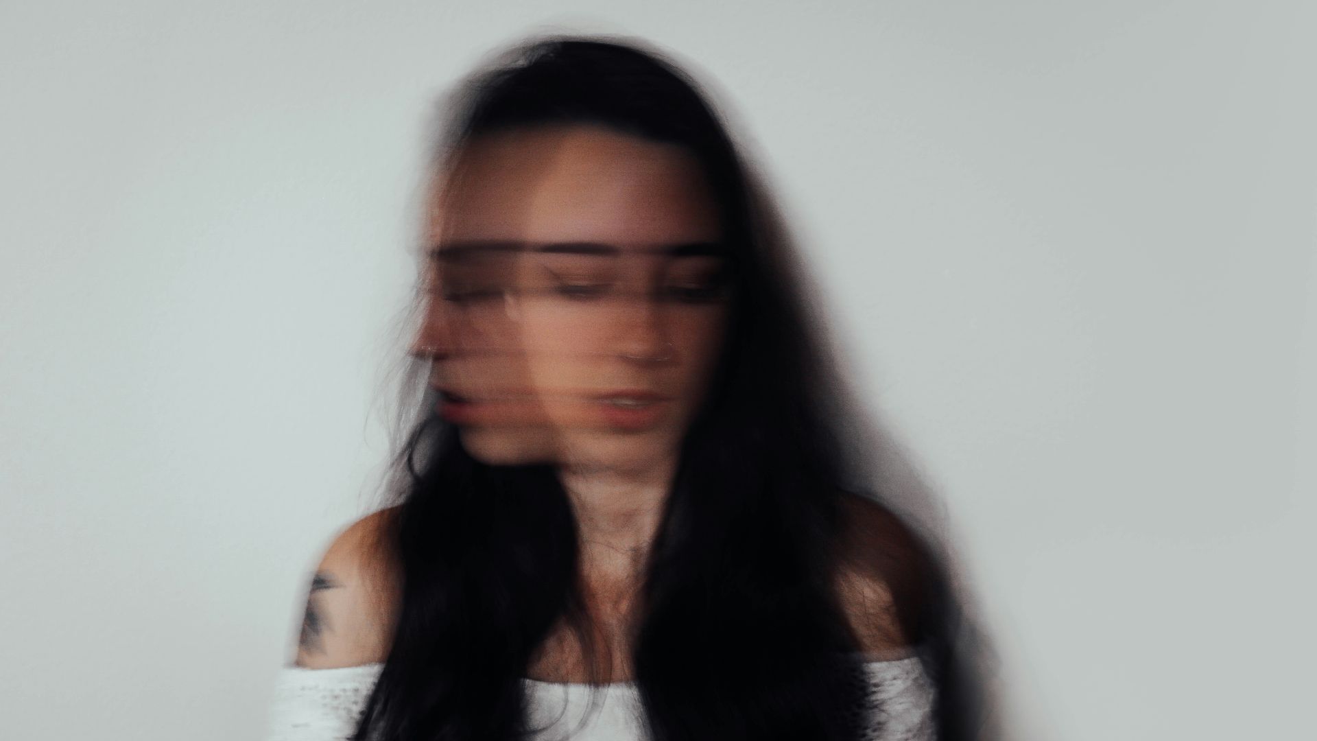 a blurry photo of a woman with glasses