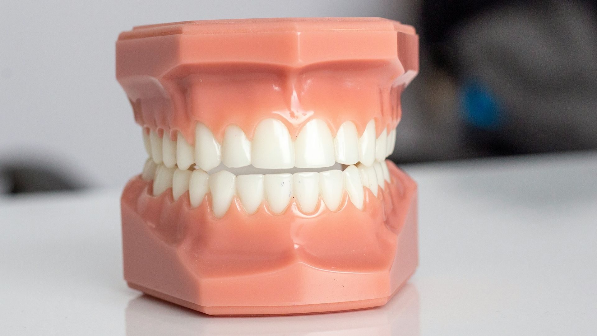 orange plastic container on white table