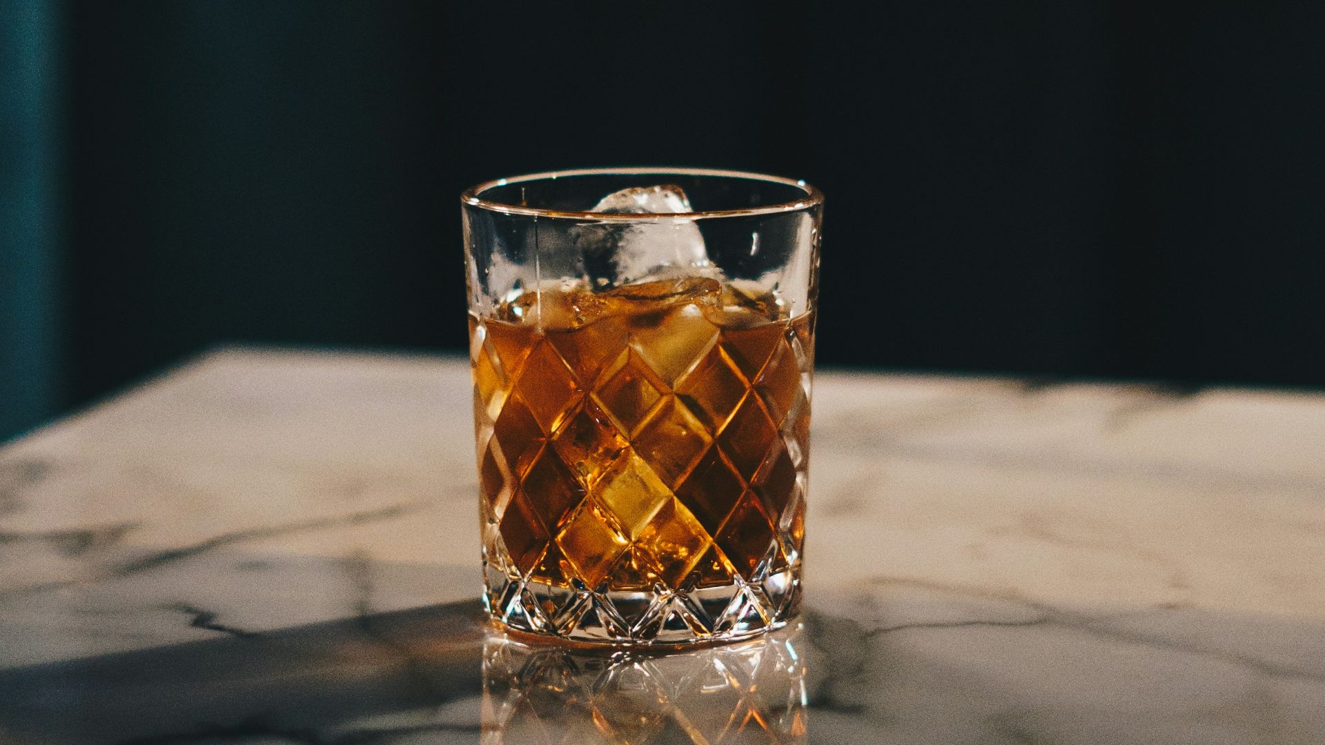 clear drinking glass with yellow liquid