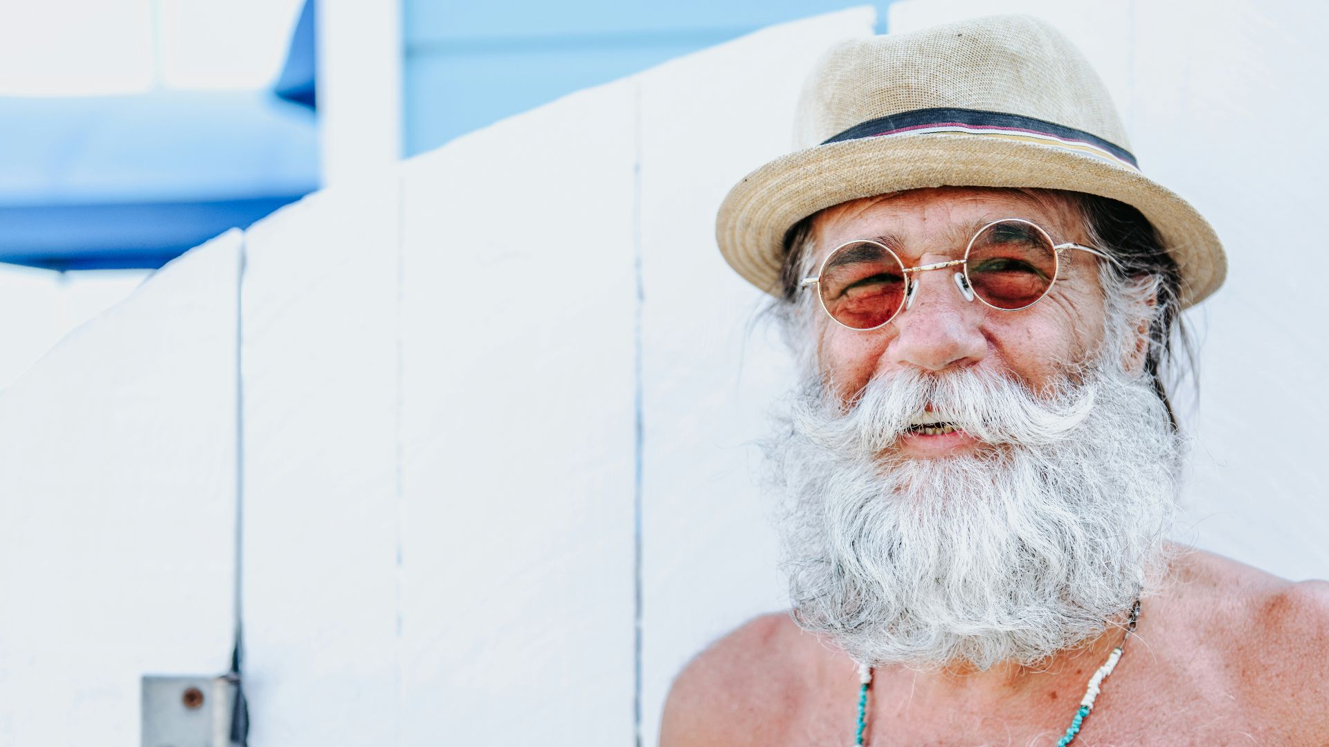 a man with a white beard and hat