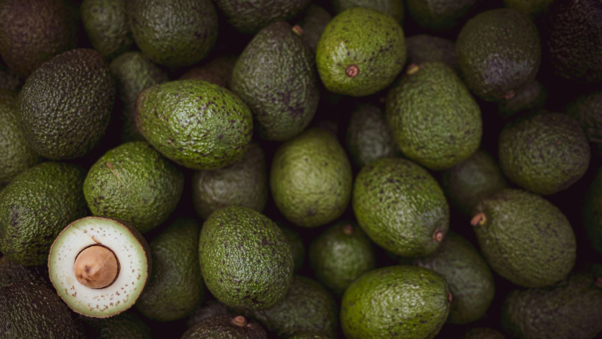 green fruits on black surface
