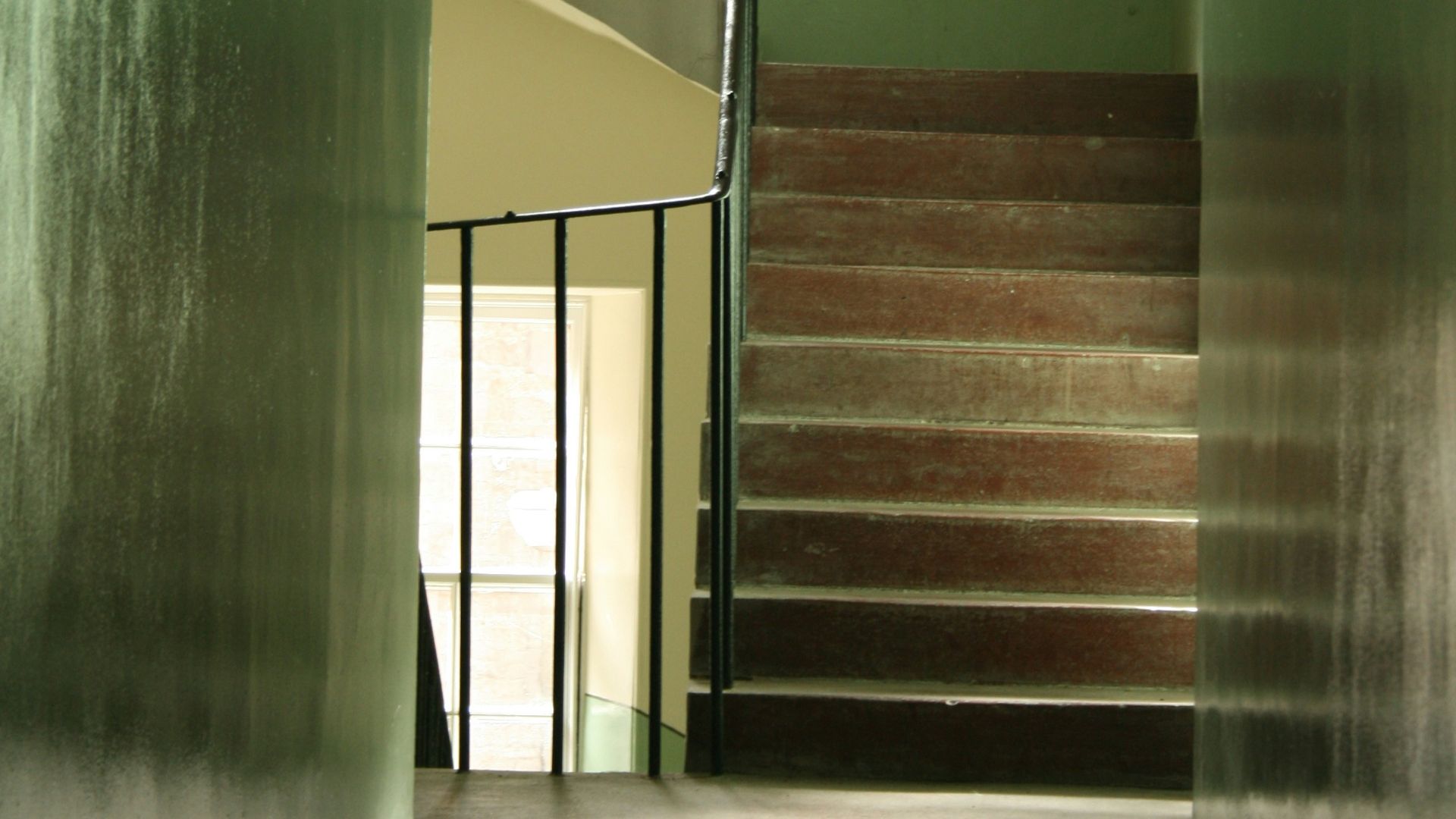 green and yellow concrete staircase