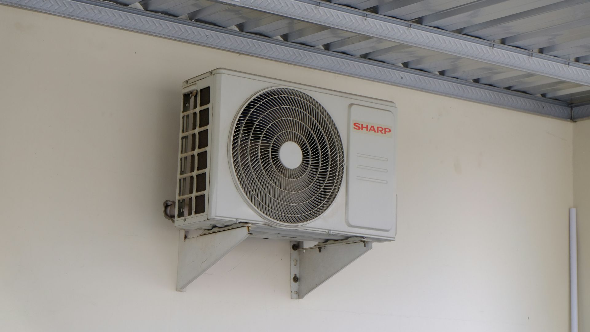 An air conditioning unit mounted on a wall.