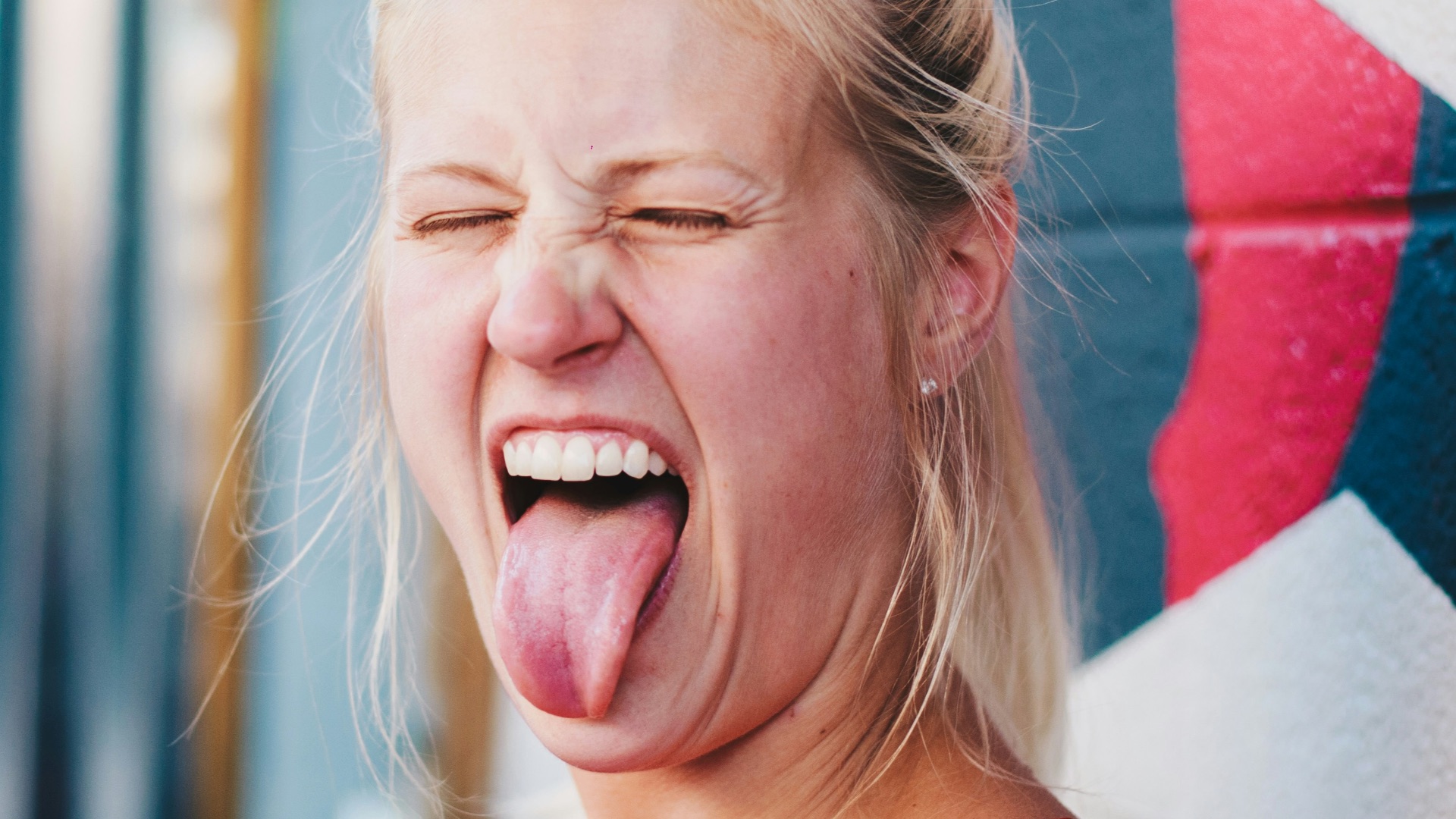 woman showing tongue