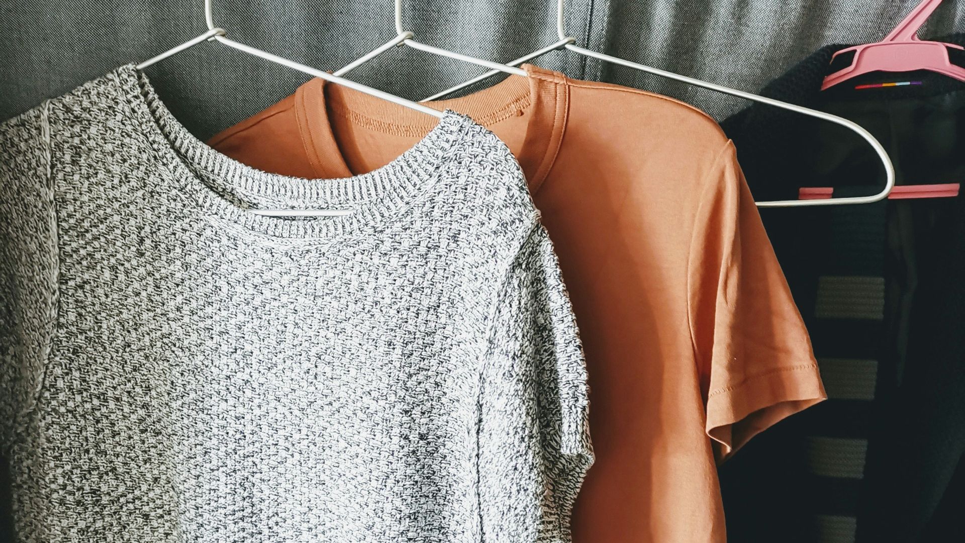 three assorted-color shirts