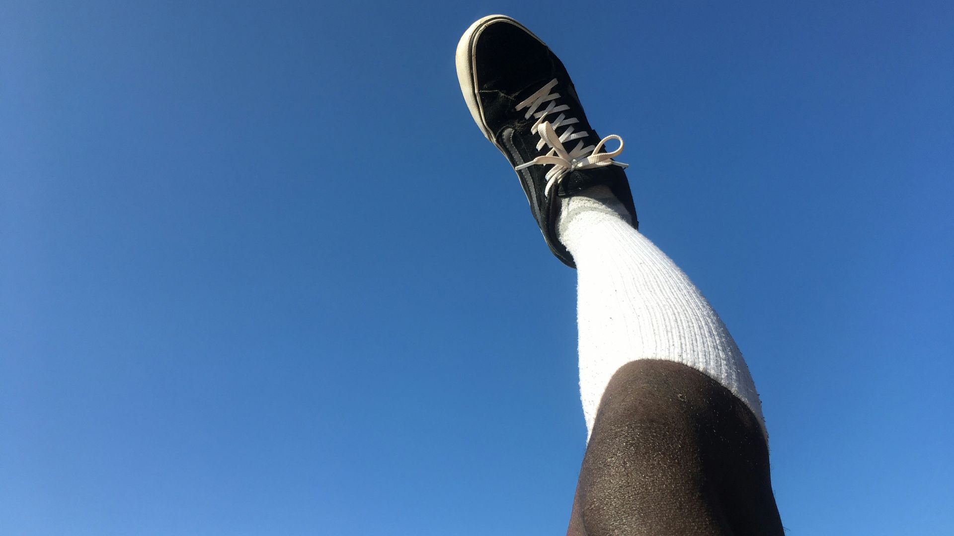 a person's leg with a shoe on it