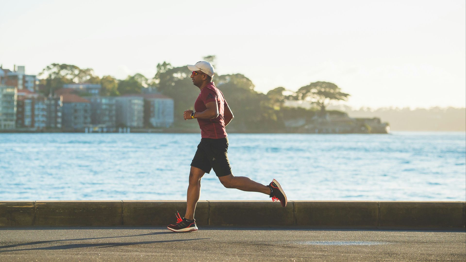 man running near sea during daytime