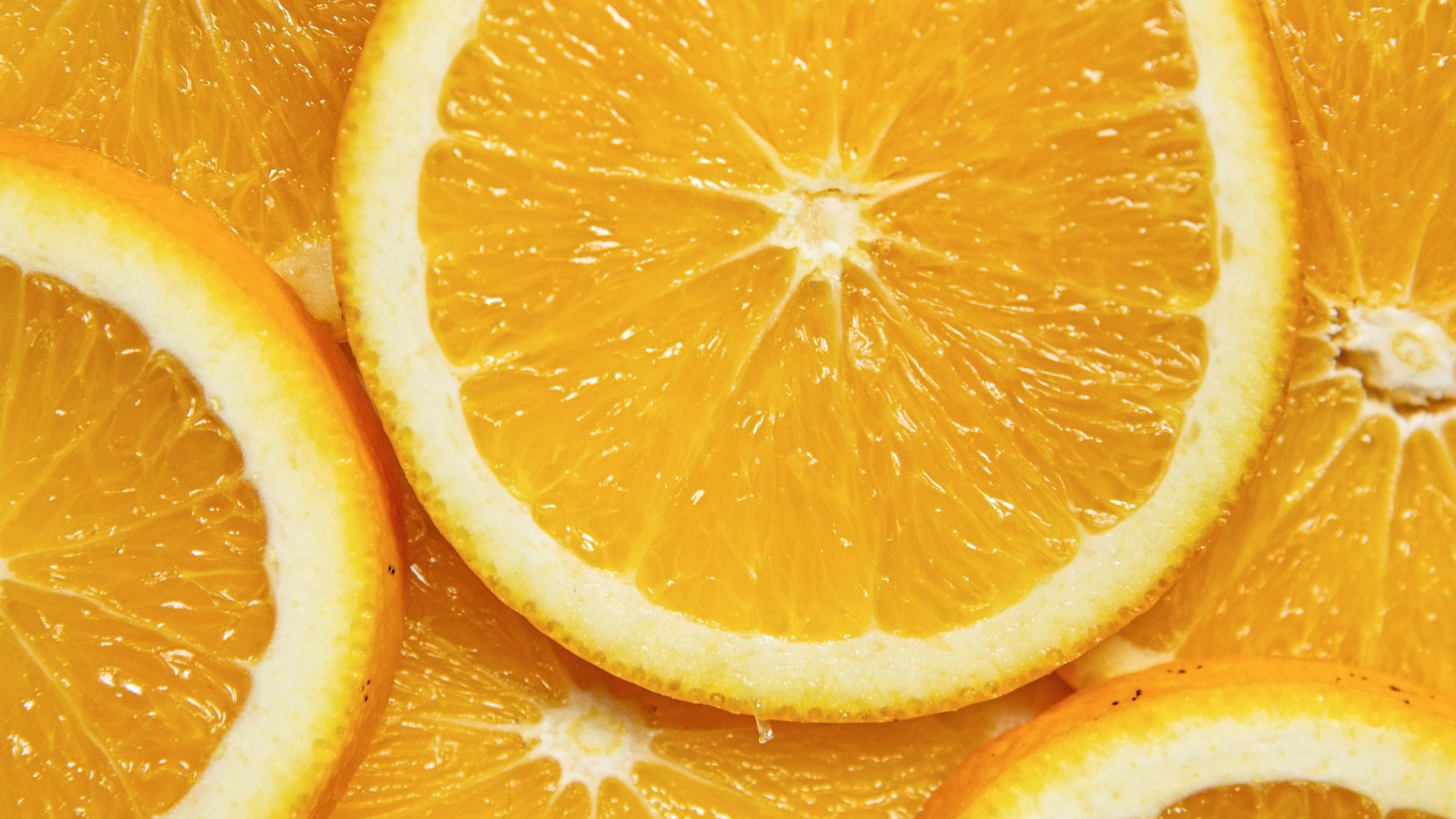 sliced orange fruit on white ceramic plate