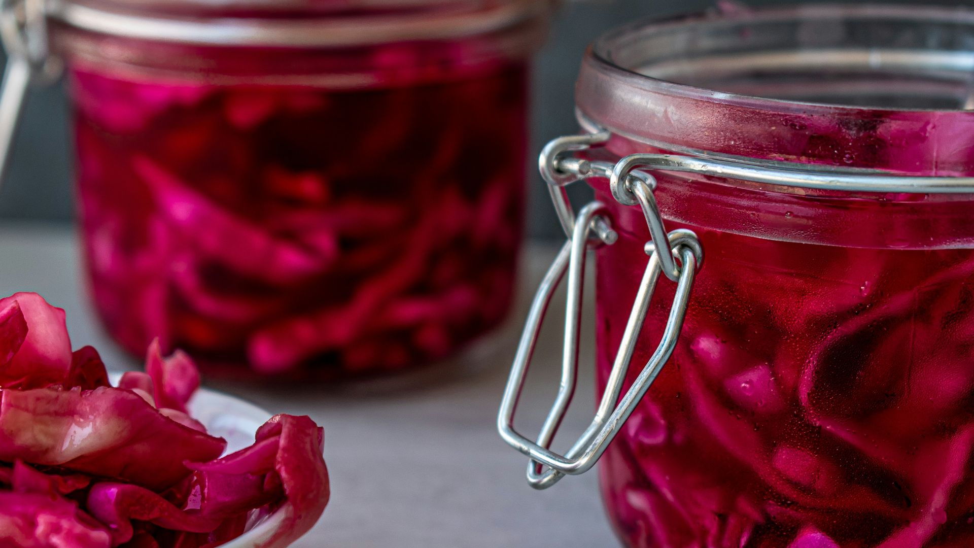 red liquid in clear glass jar