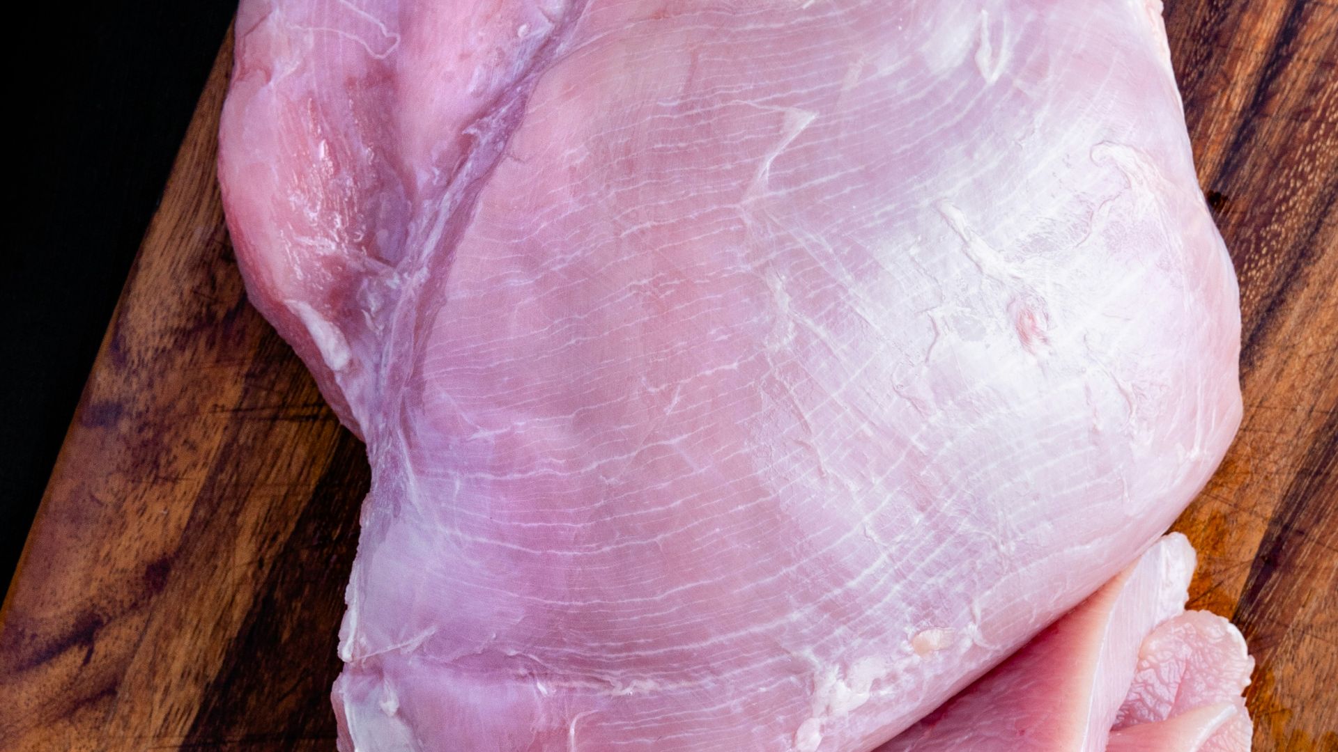 raw meat on brown wooden table