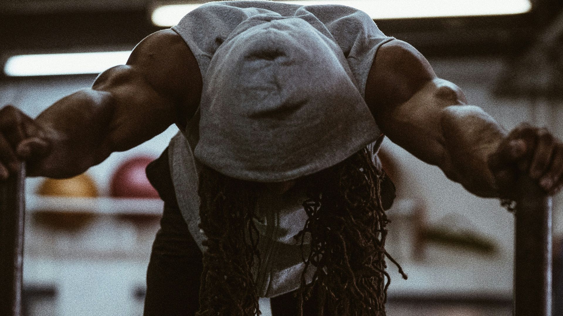 person facing down and holding two rods