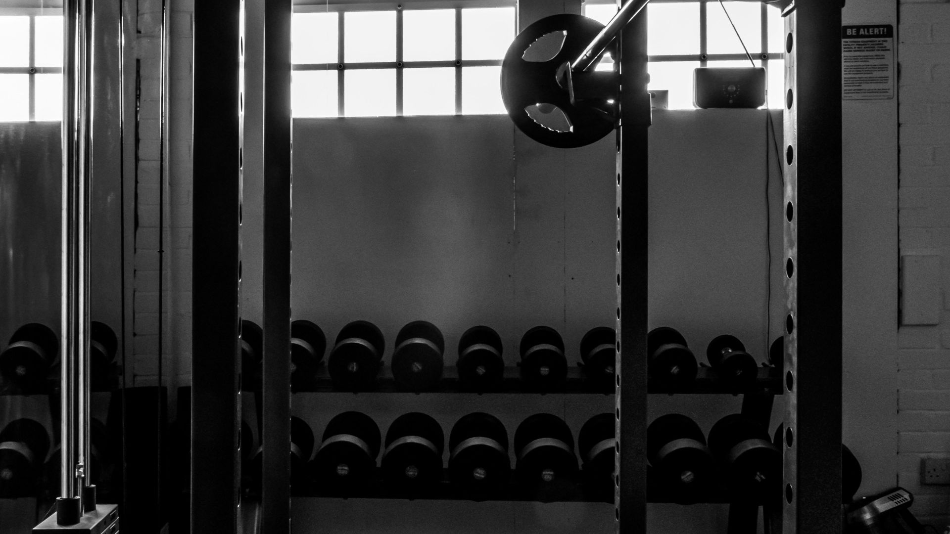 exercise equipments in grayscale photography