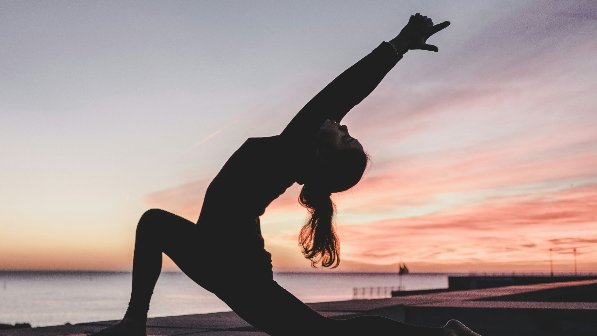 silhouette photography of woman doing yoga