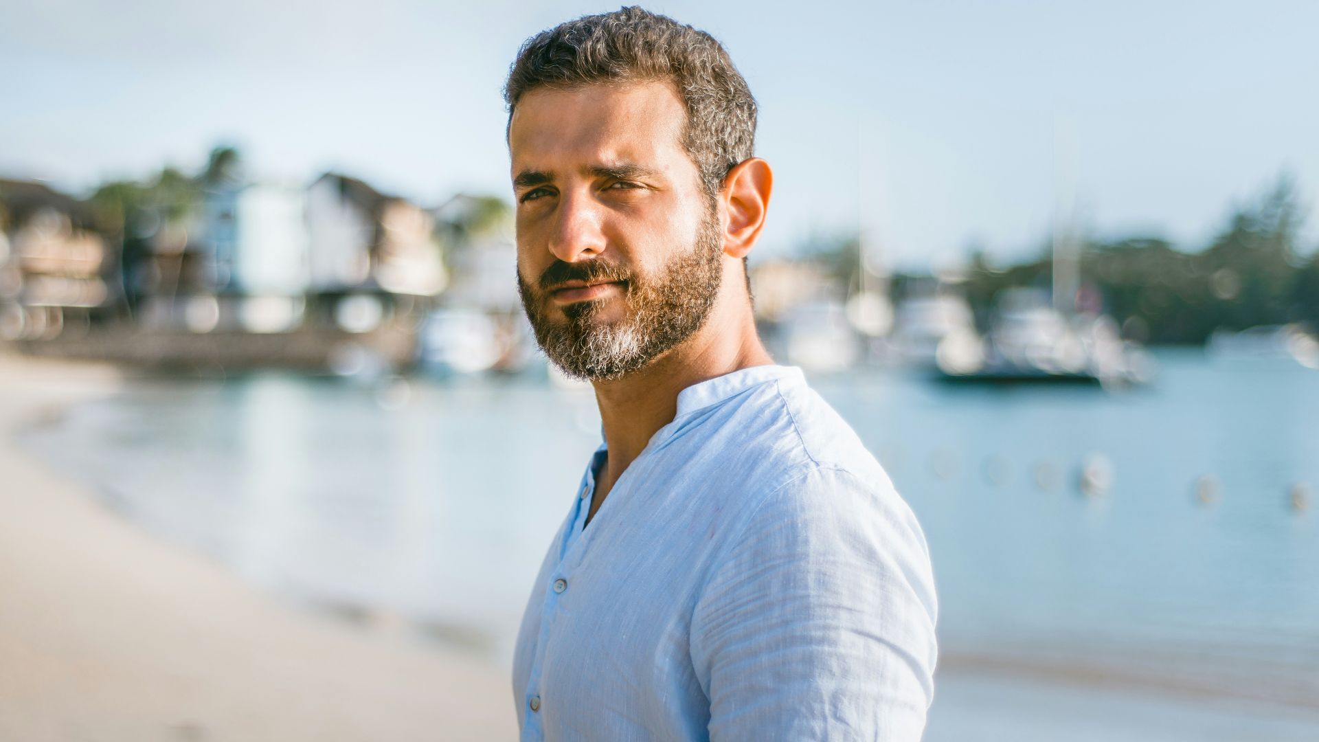 man standing on beach during daytime