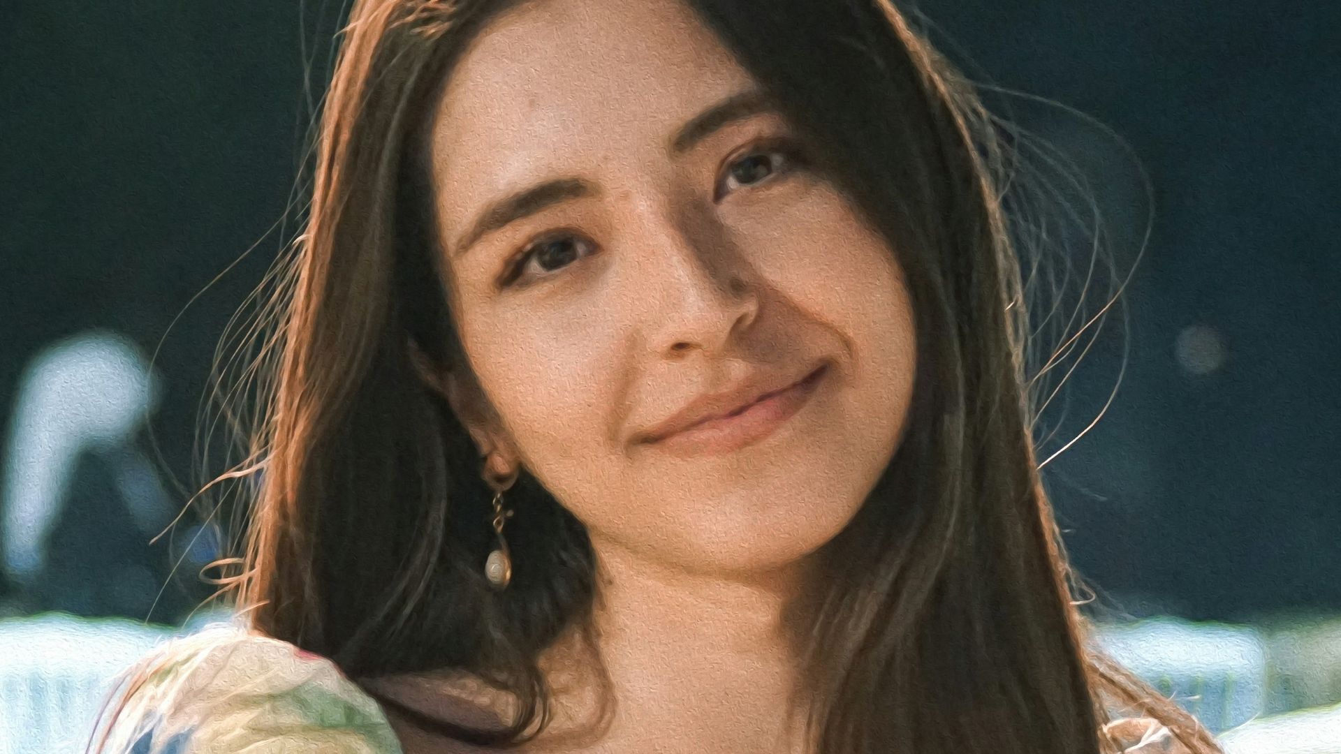a woman sitting on a white chair next to a table