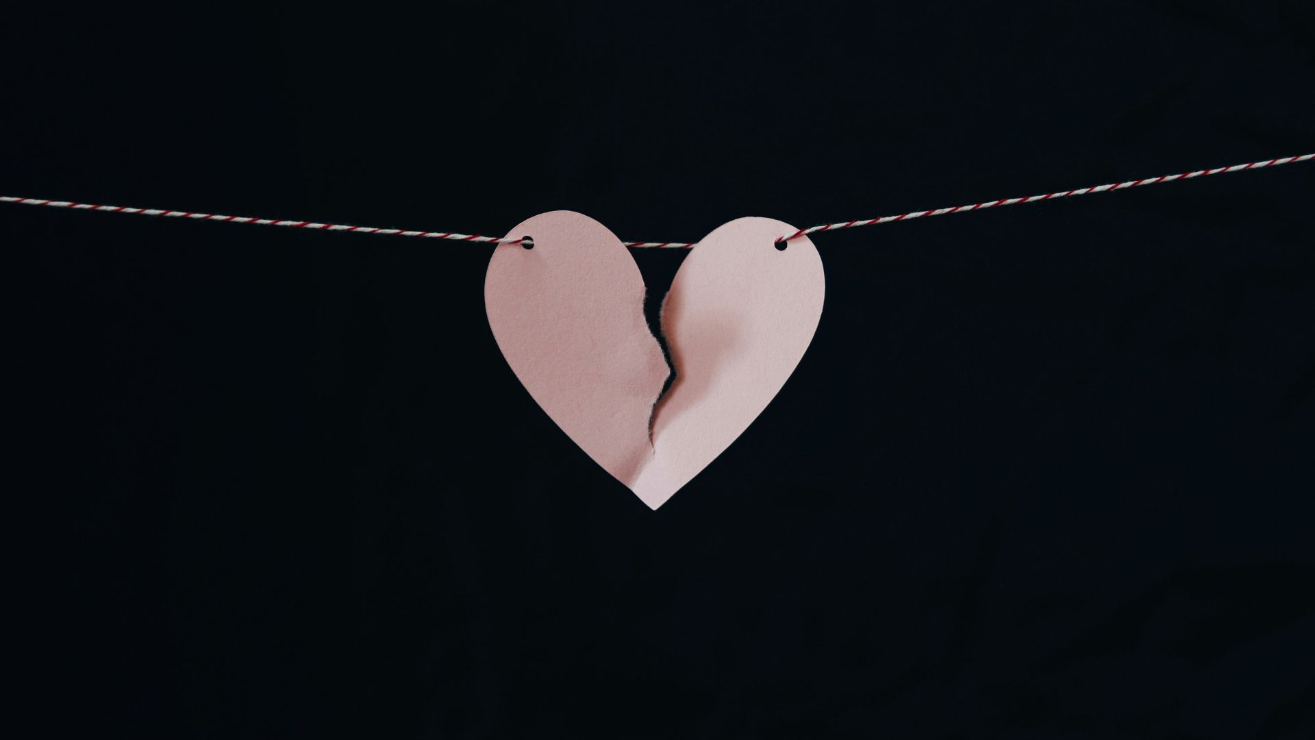 broken heart hanging on wire