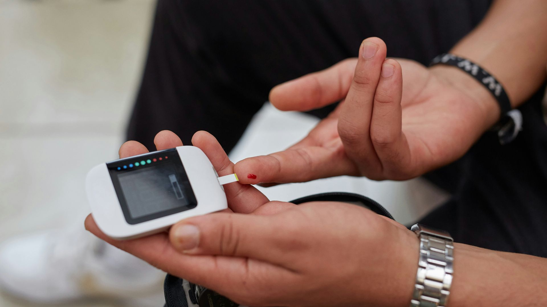 a person blood glucose testing using gluco-meter