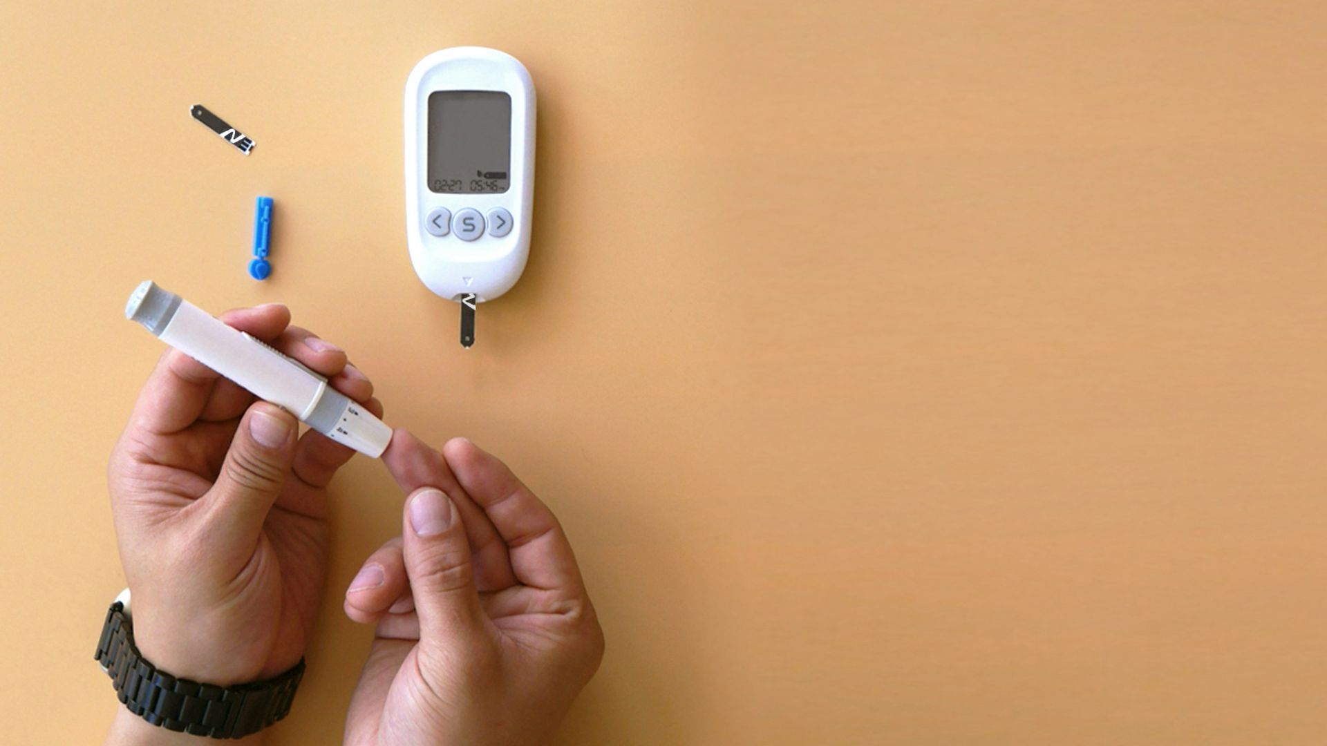 a person holding a thermometer next to an electronic device