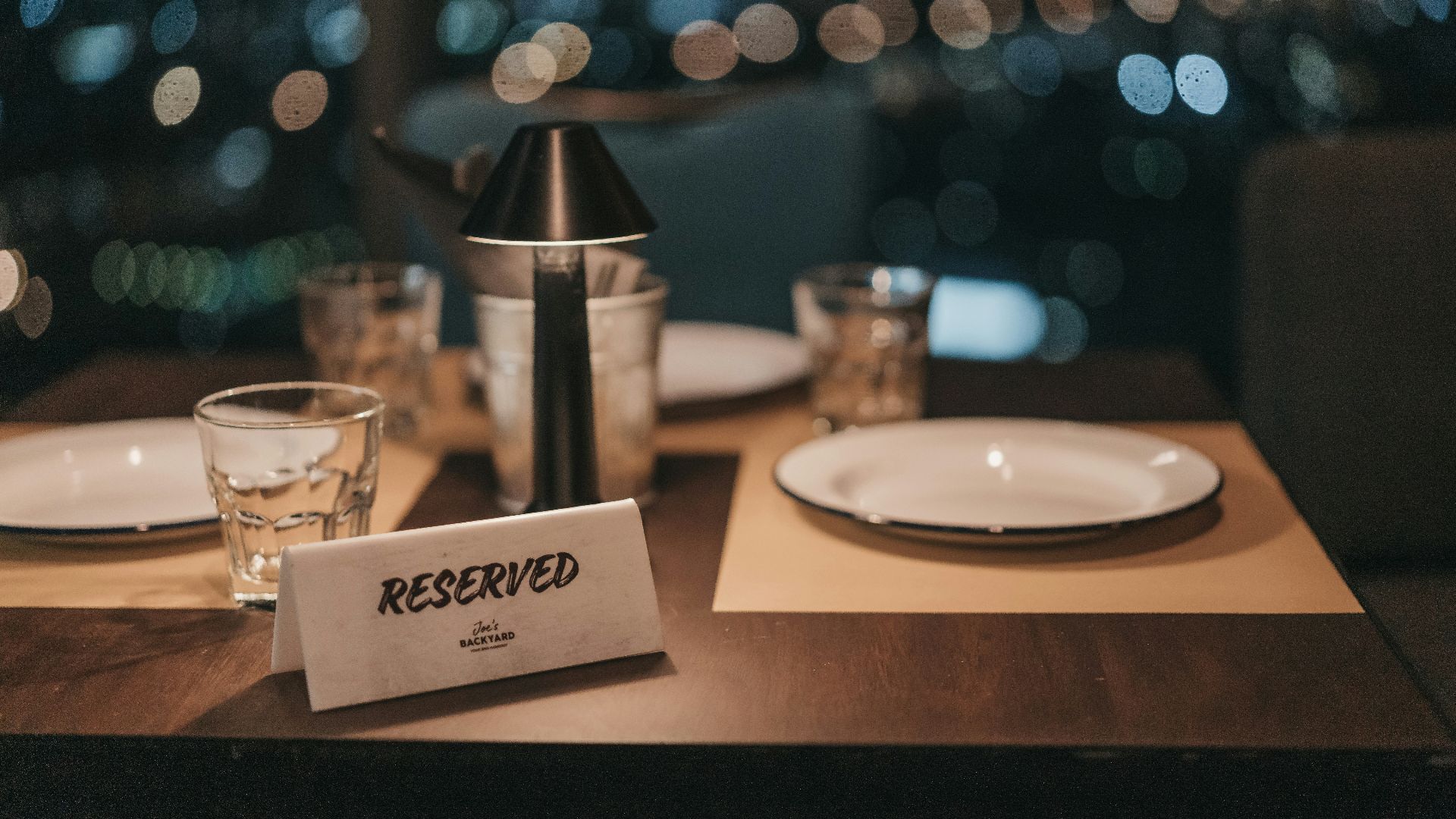 white ceramic plate on brown wooden table