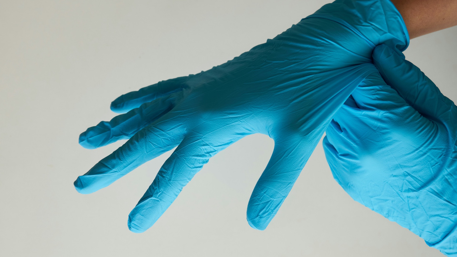 persons hand with blue paint