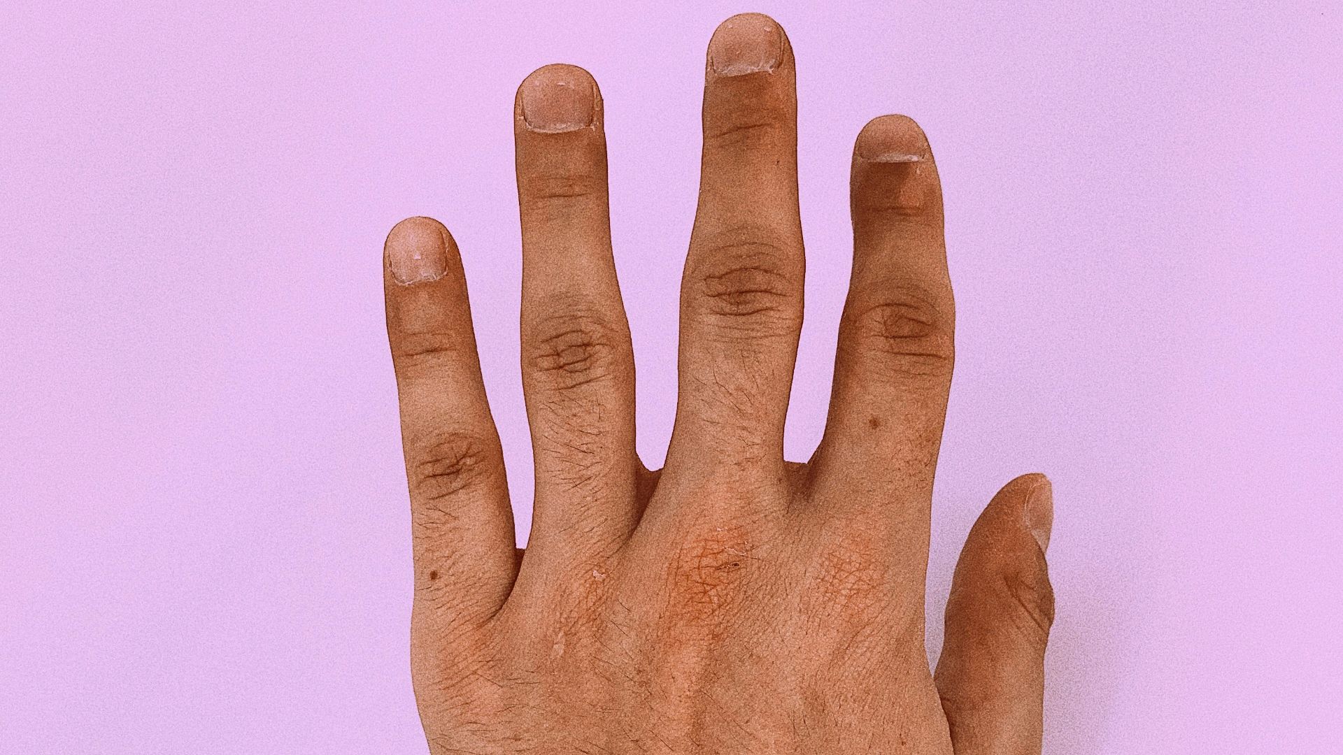 persons left hand on white surface