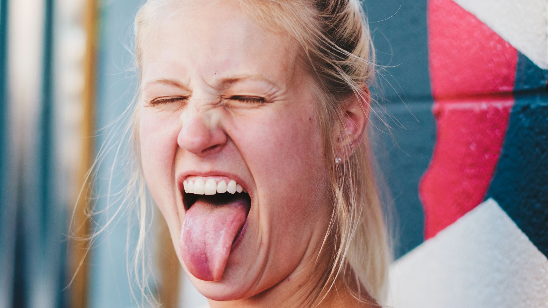 woman showing tongue
