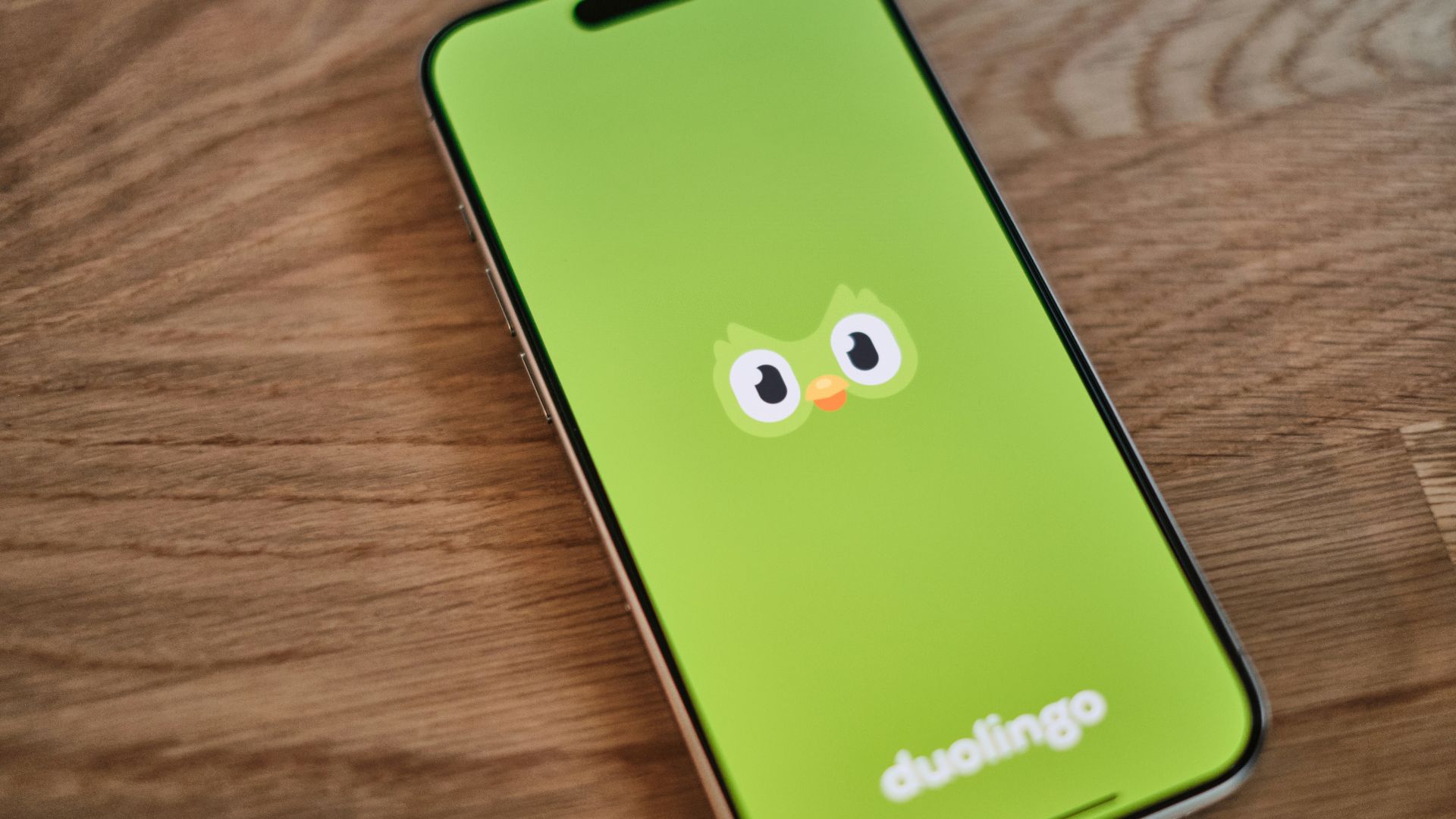 A green phone with a face drawn on it