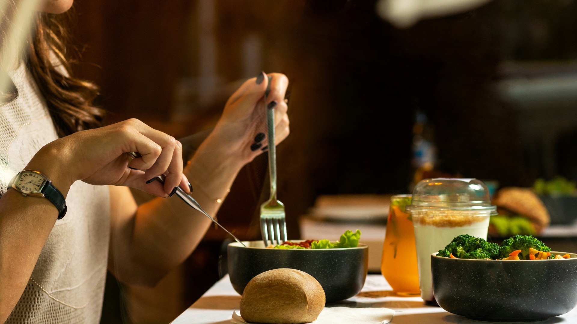 person holding silver fork and knife