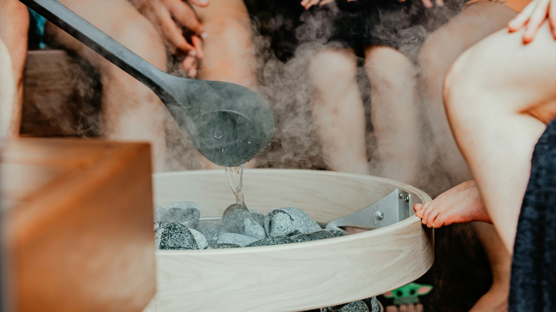 a person pouring water into a glass