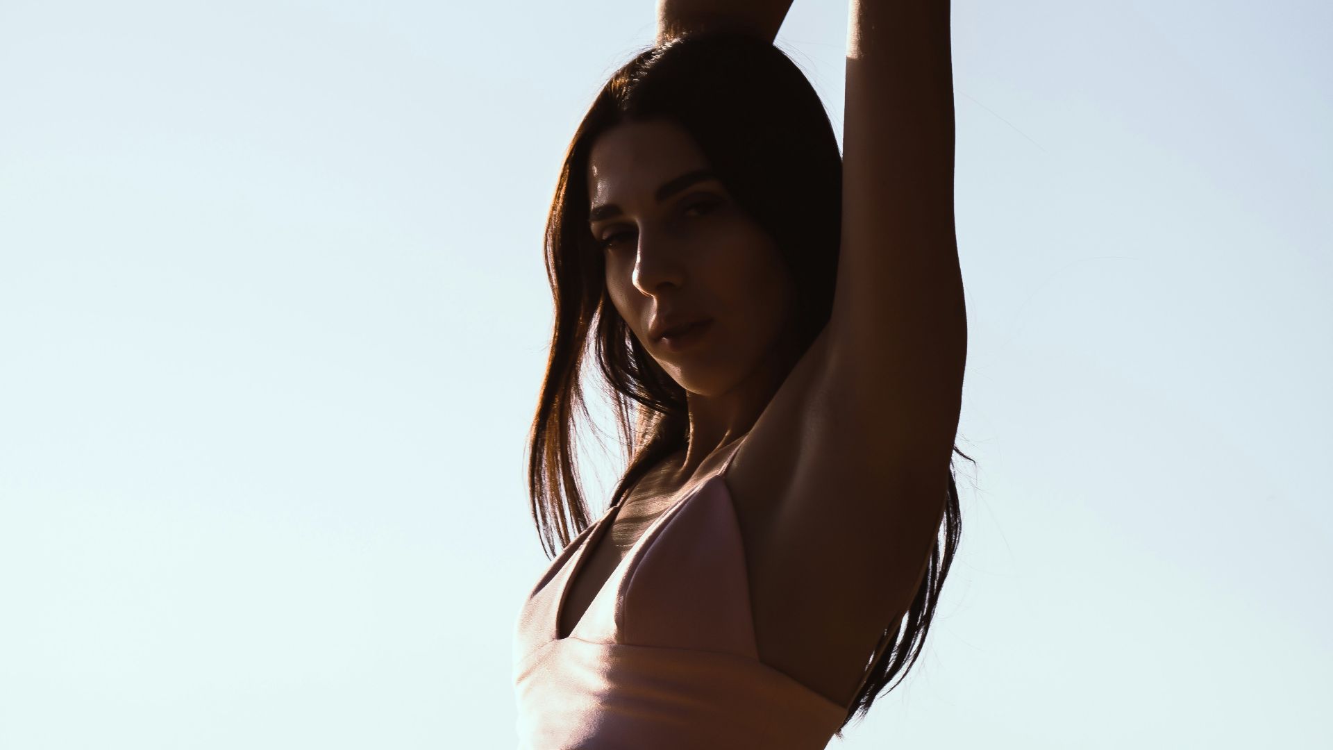 woman in white bikini standing on beach during daytime