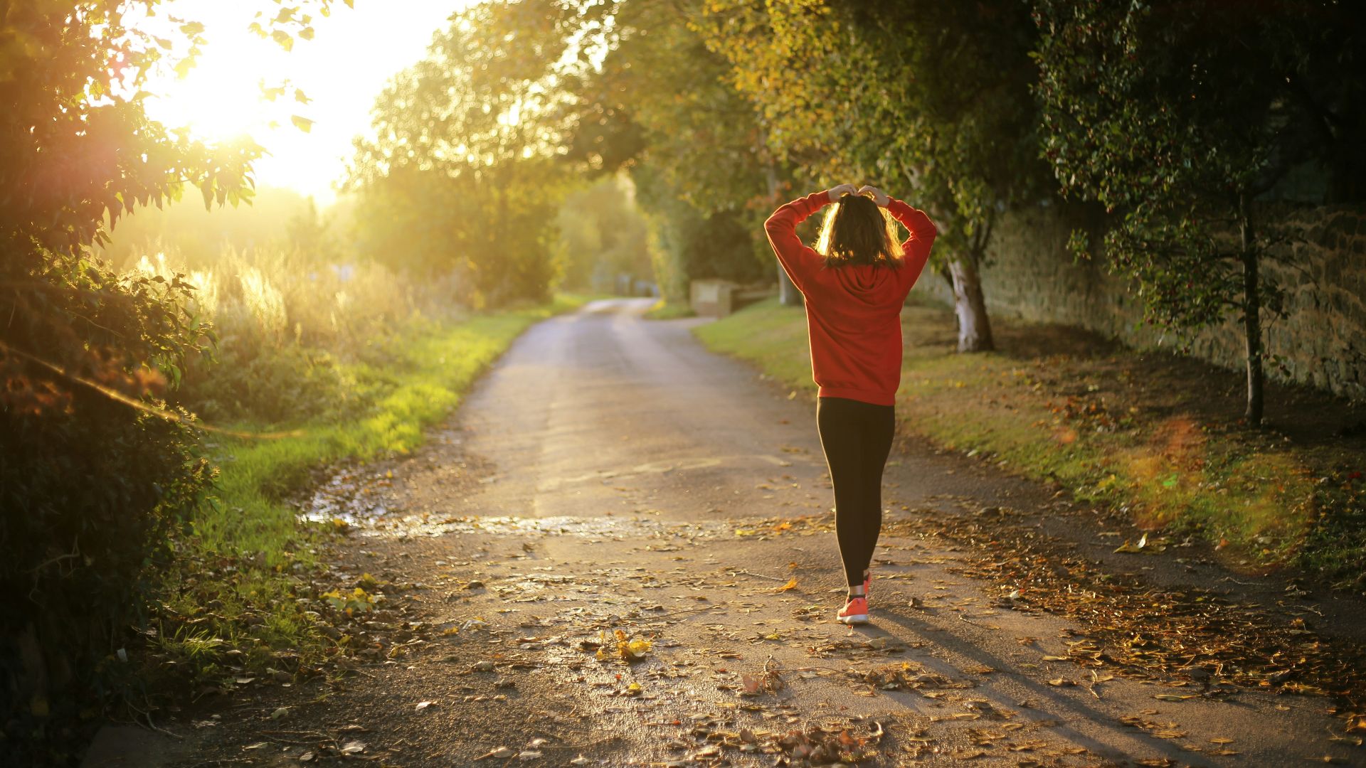 woman walking on pathway during daytime