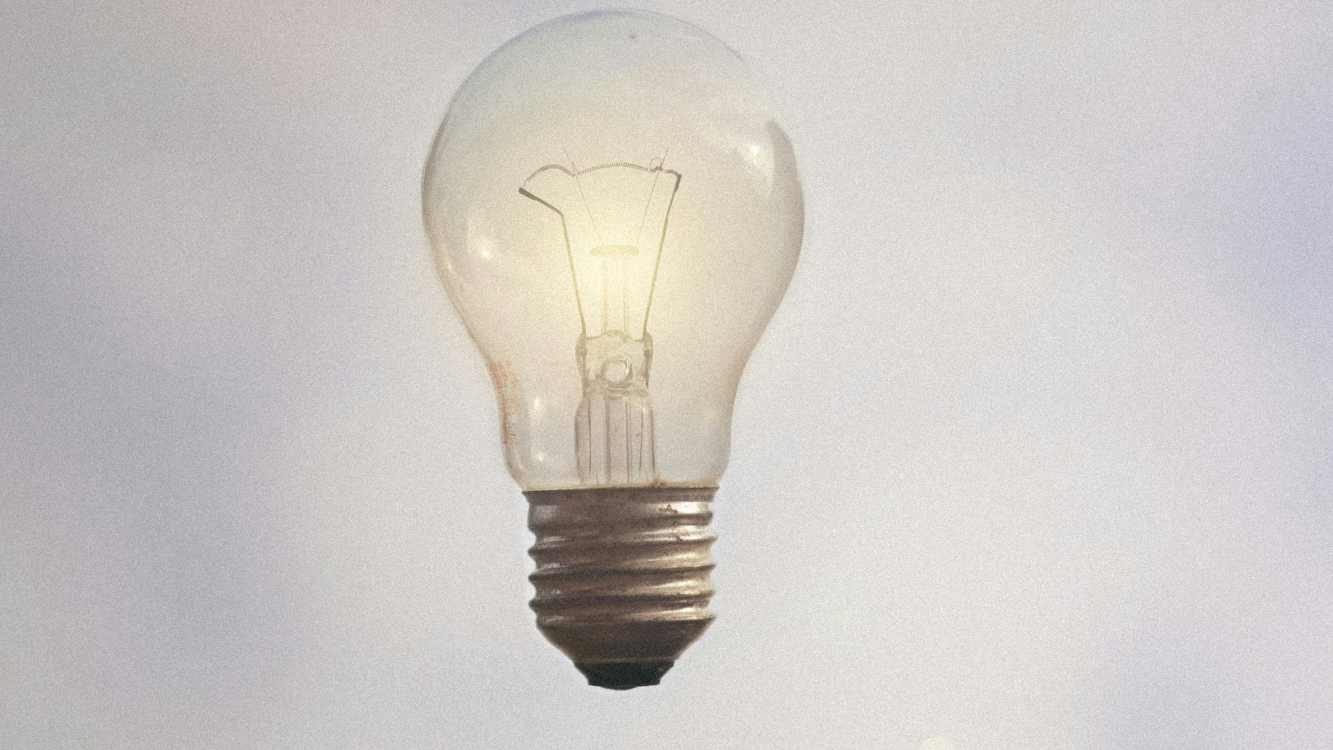 person catching light bulb