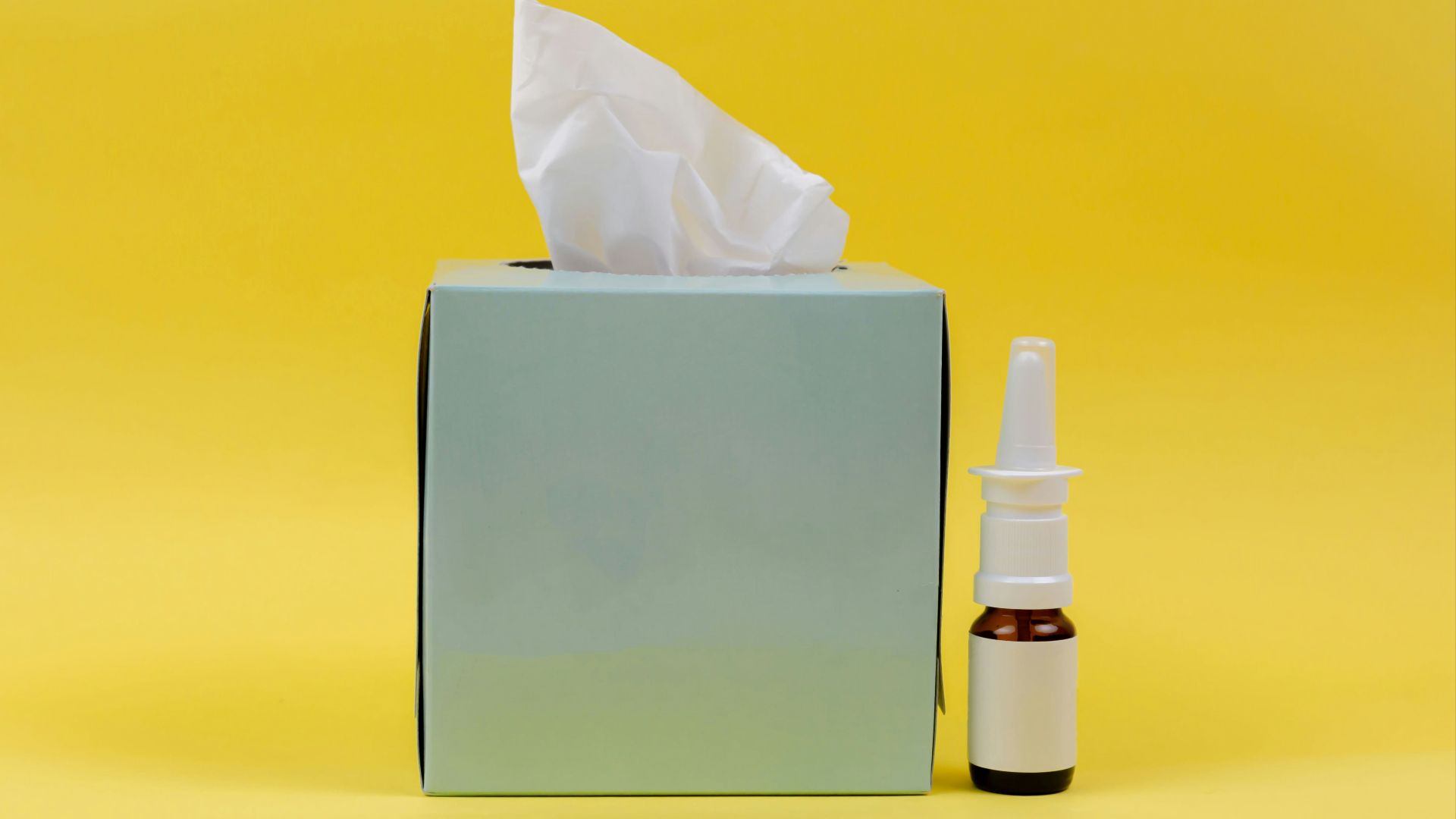 white and brown bottle beside white tissue box