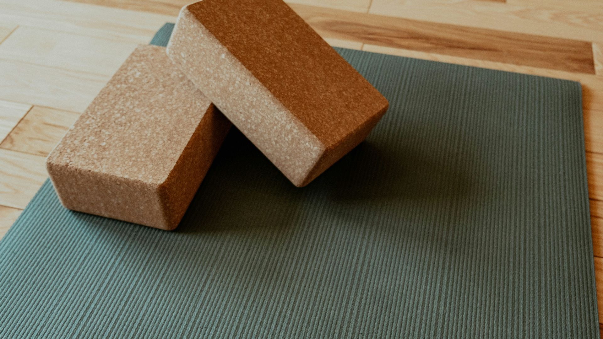 a yoga mat with two blocks on top of it