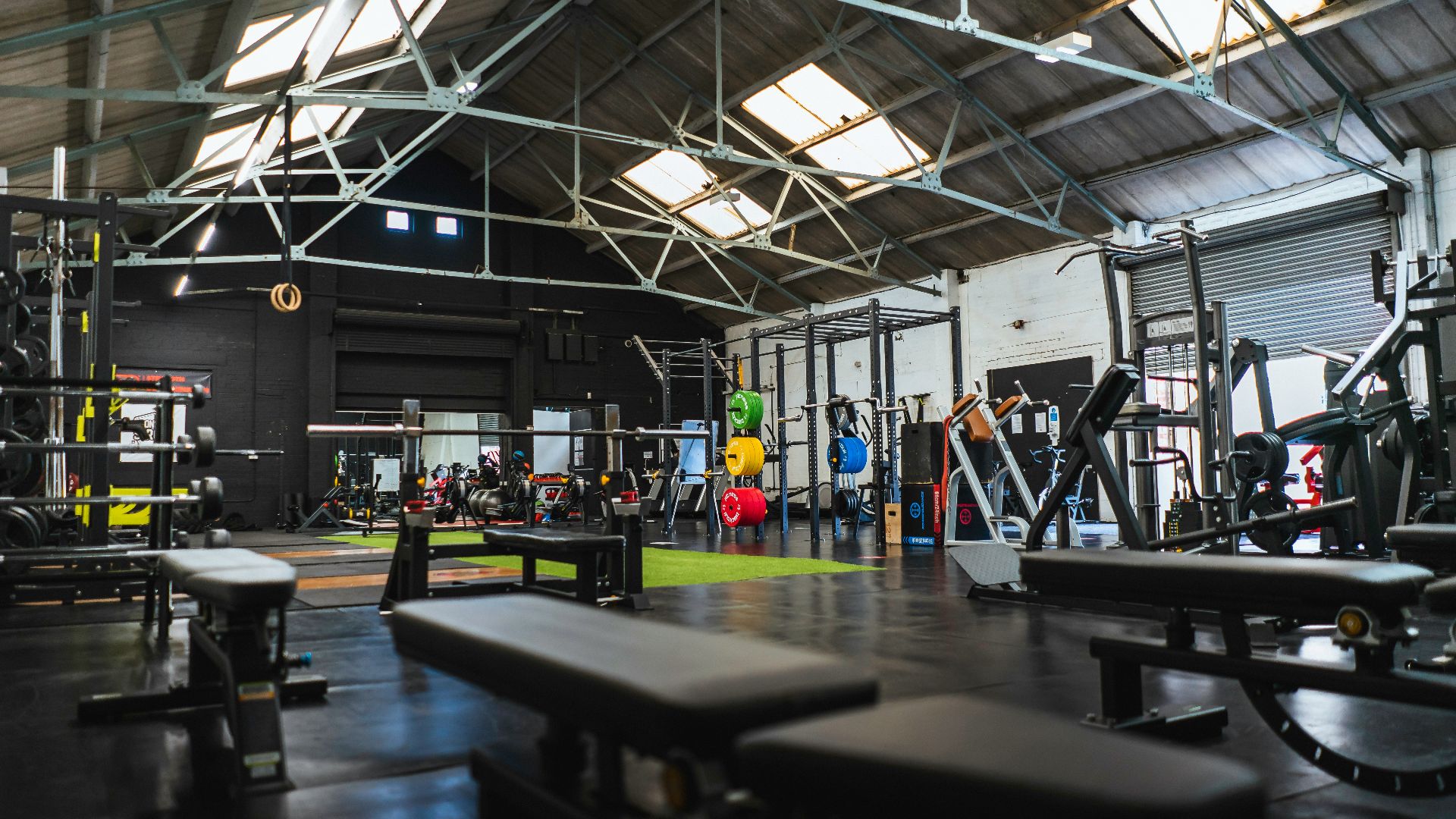 people in a room with a black table and chairs