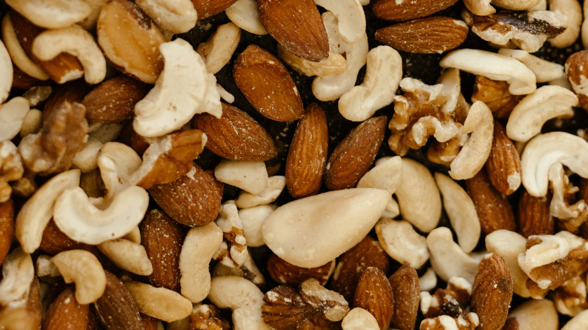 a mixture of nuts and nutshells in a bowl